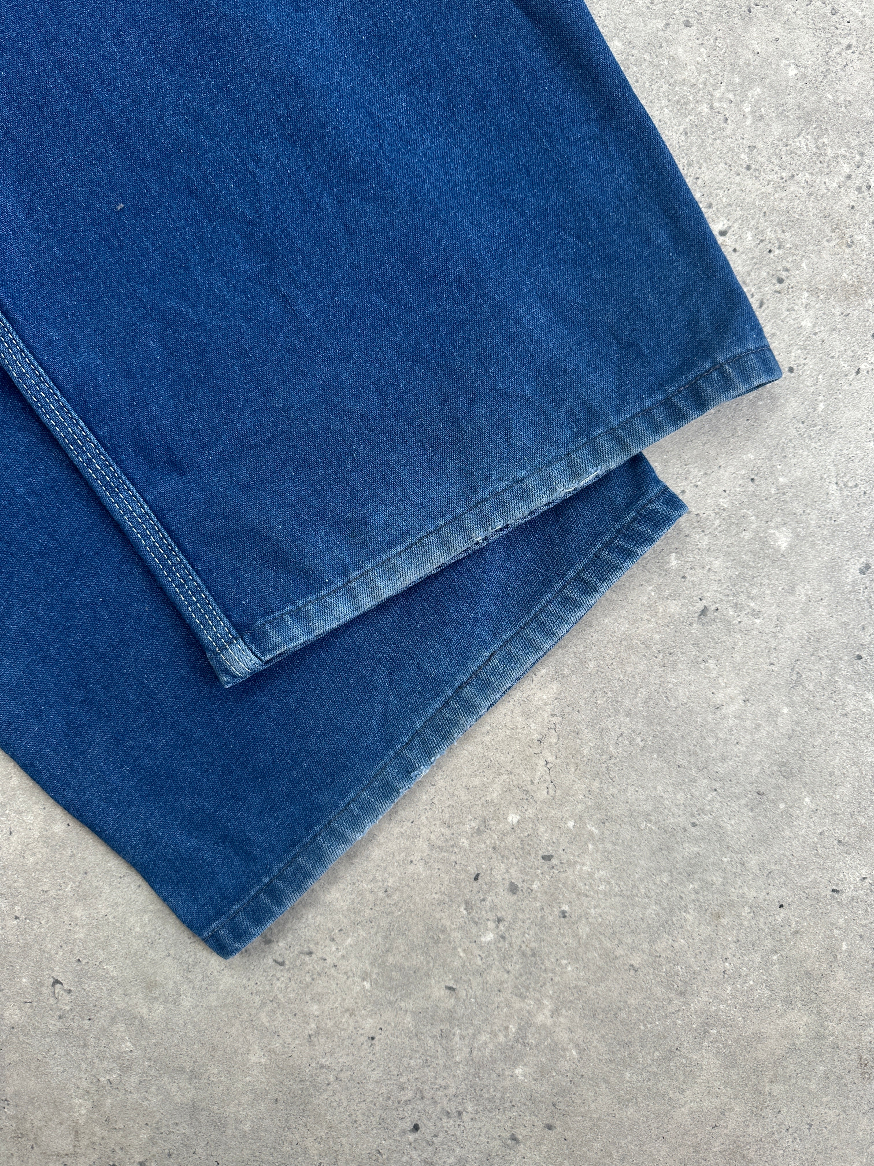 Vintage Roebucks contrast stitch mid wash denim dungarees in XL size, showing front view with adjustable straps and pockets.