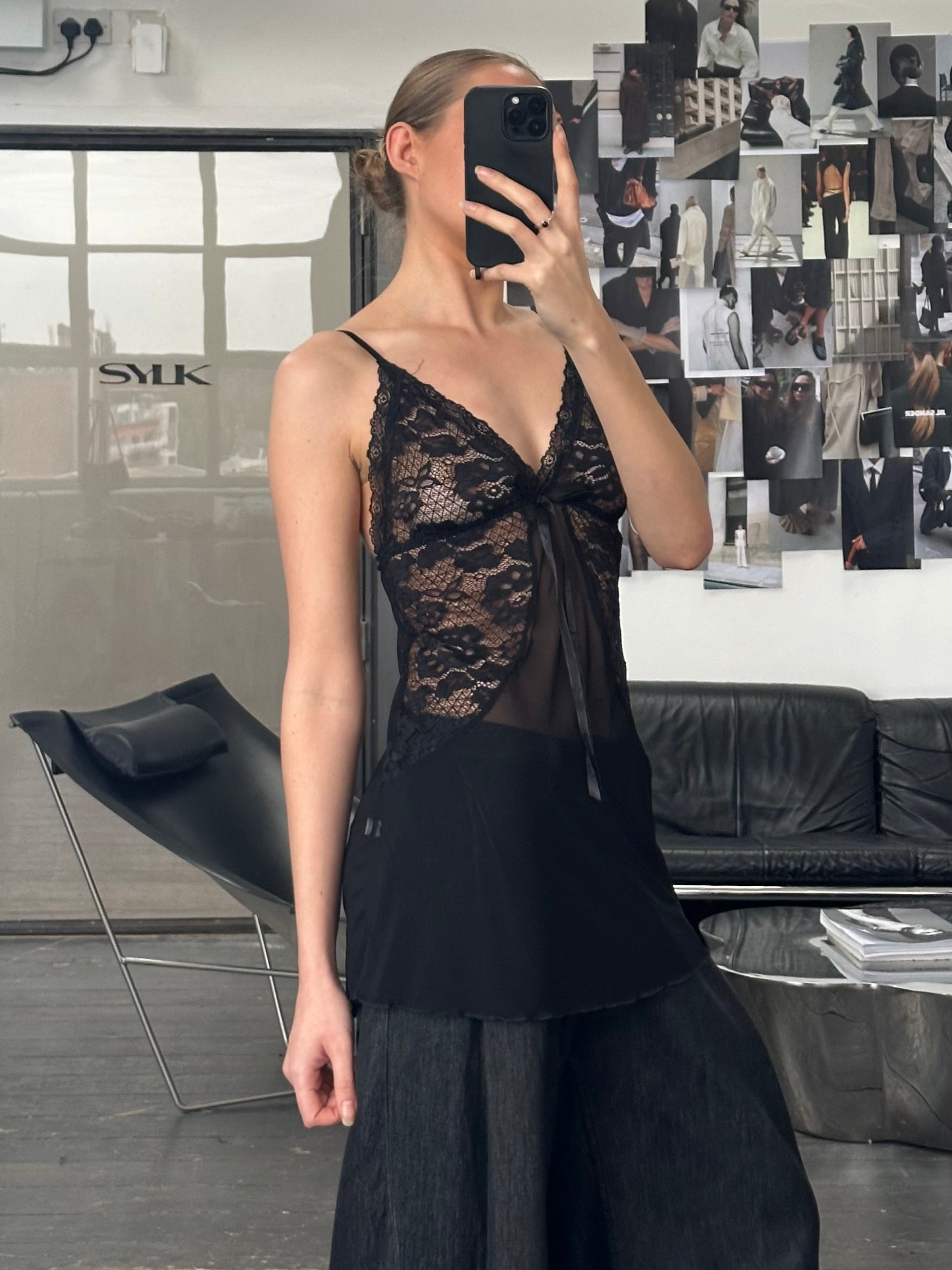 Vintage 1990s sheer lace top in size small, featuring delicate floral lace and a lightweight, feminine design.