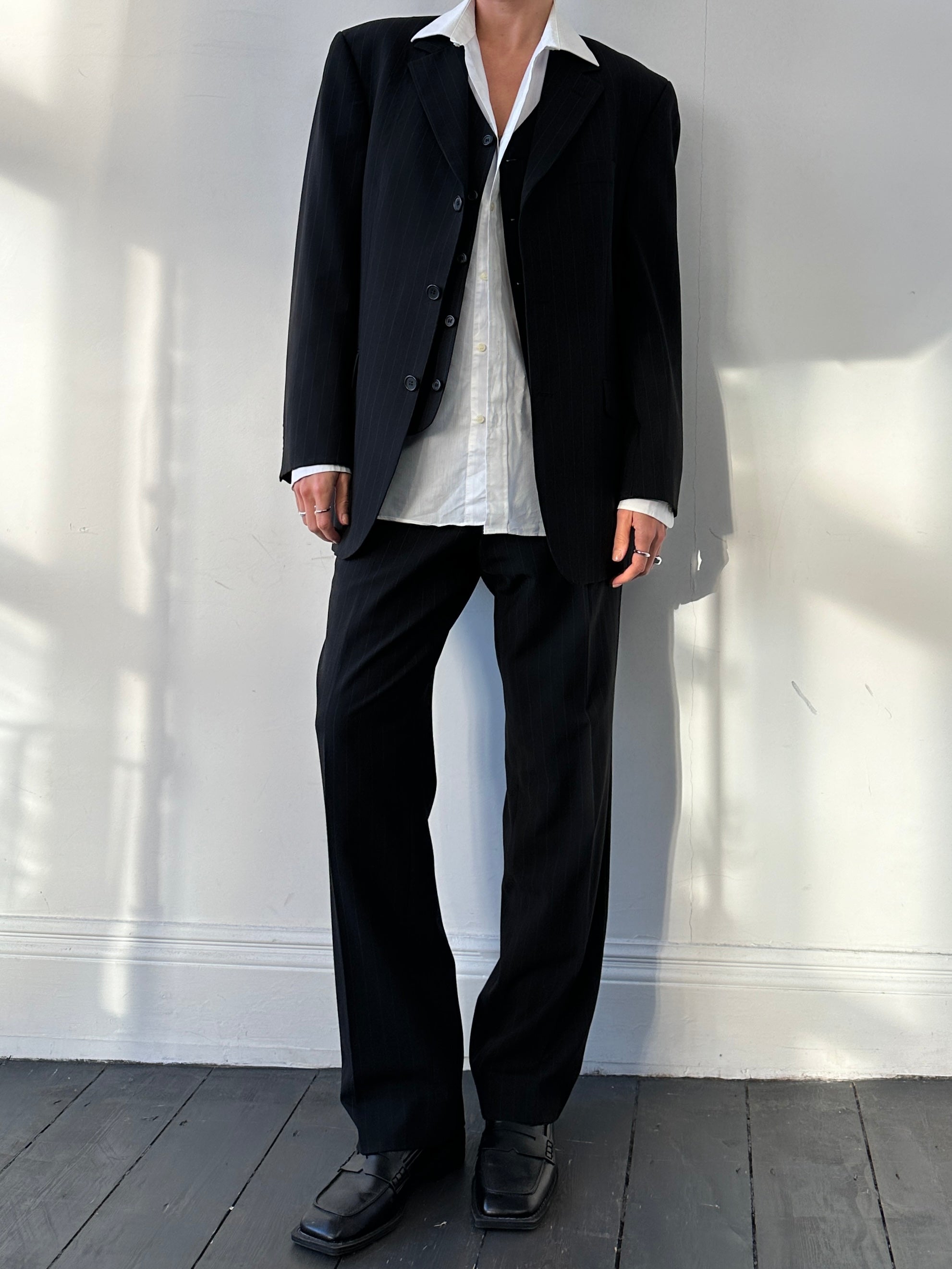Vintage pinstripe wool three-piece suit, size 40R/W32, featuring a jacket, vest, and trousers in classic tailored style.
