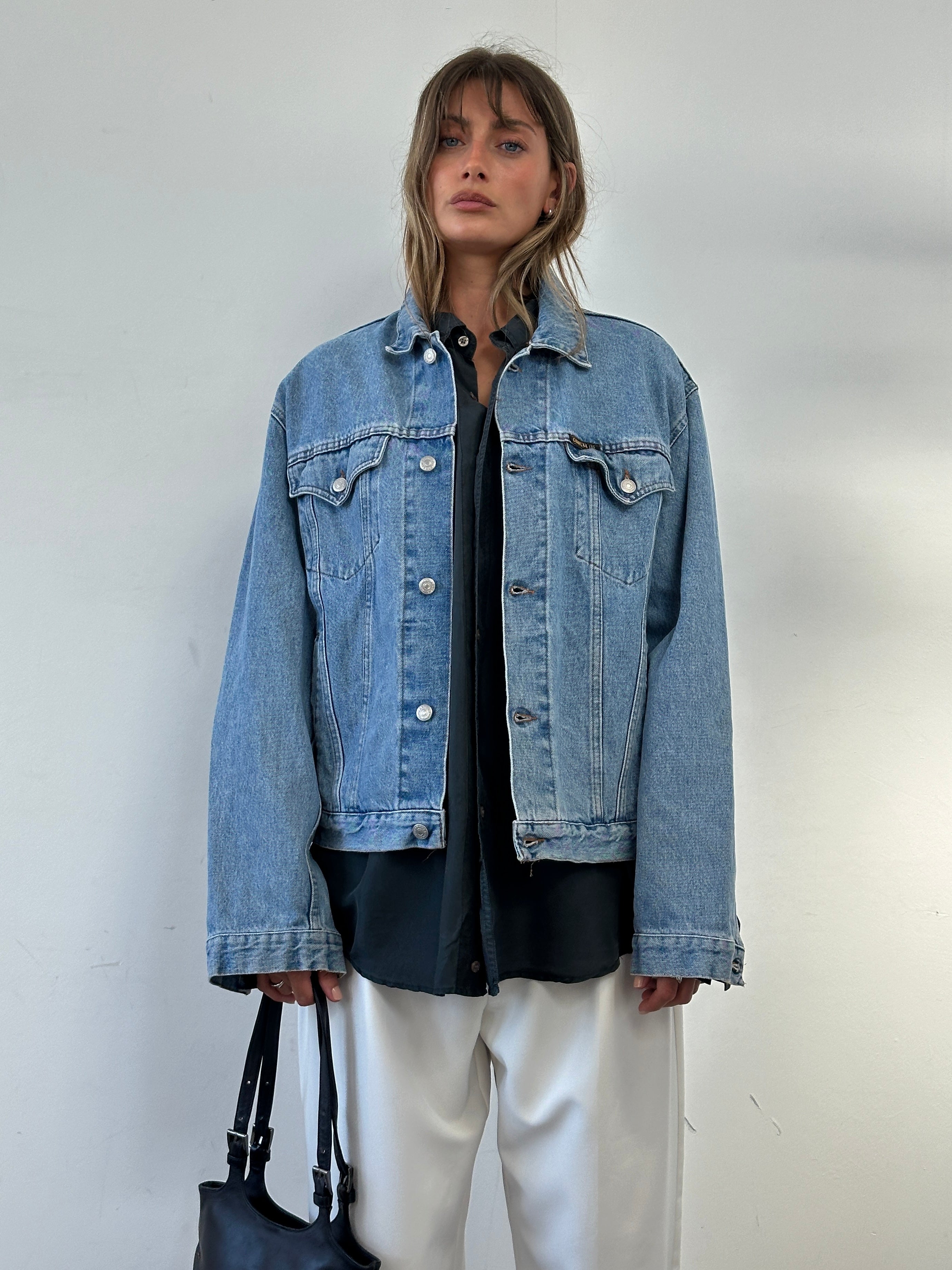 Carrera Italian oversized denim jacket from the 80s-90s, shown in a relaxed fit with classic denim wash, size large.