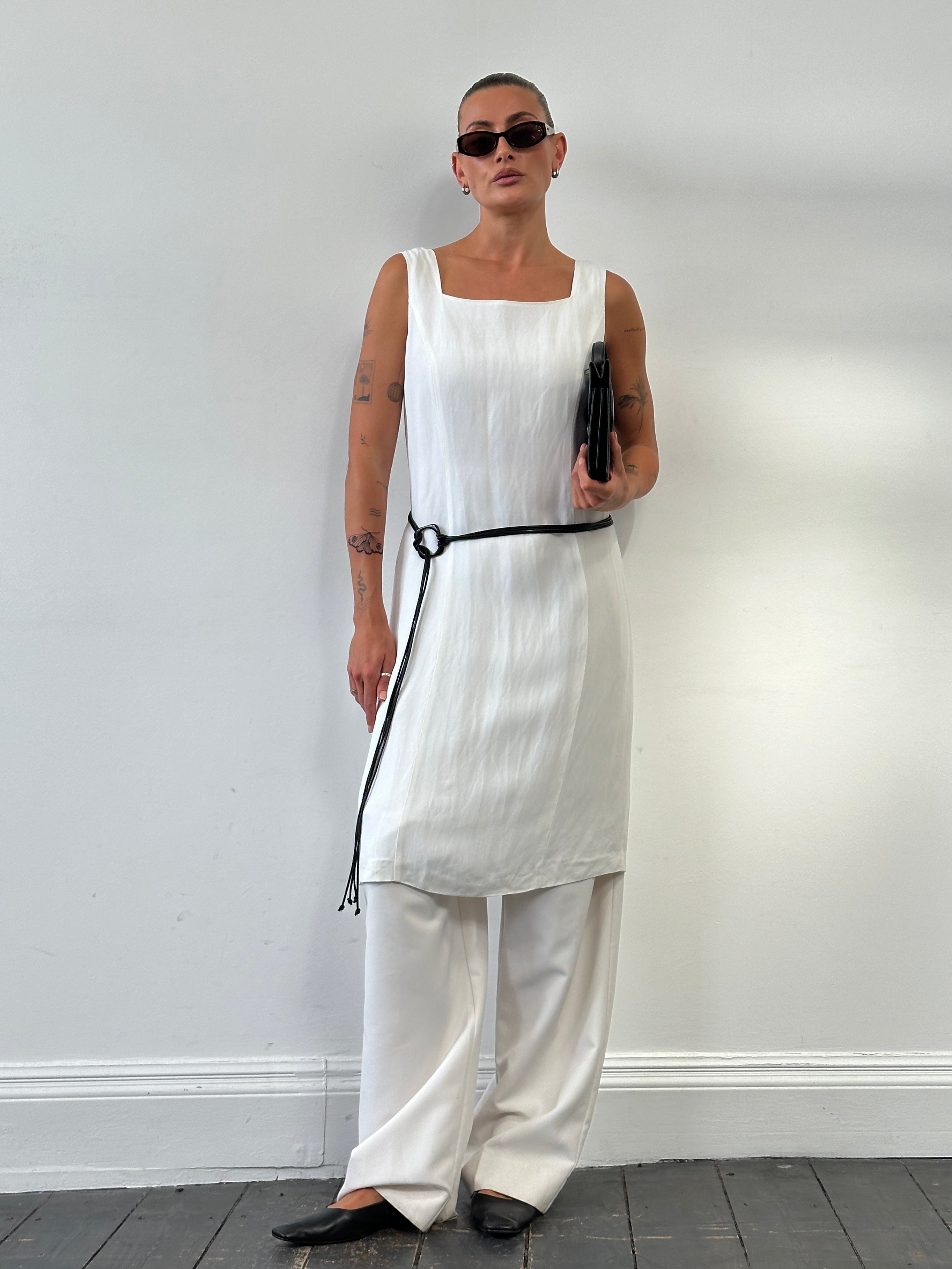 Max Mara linen square neck midi dress in size M/L displayed on a hanger, showcasing its elegant design and light fabric.
