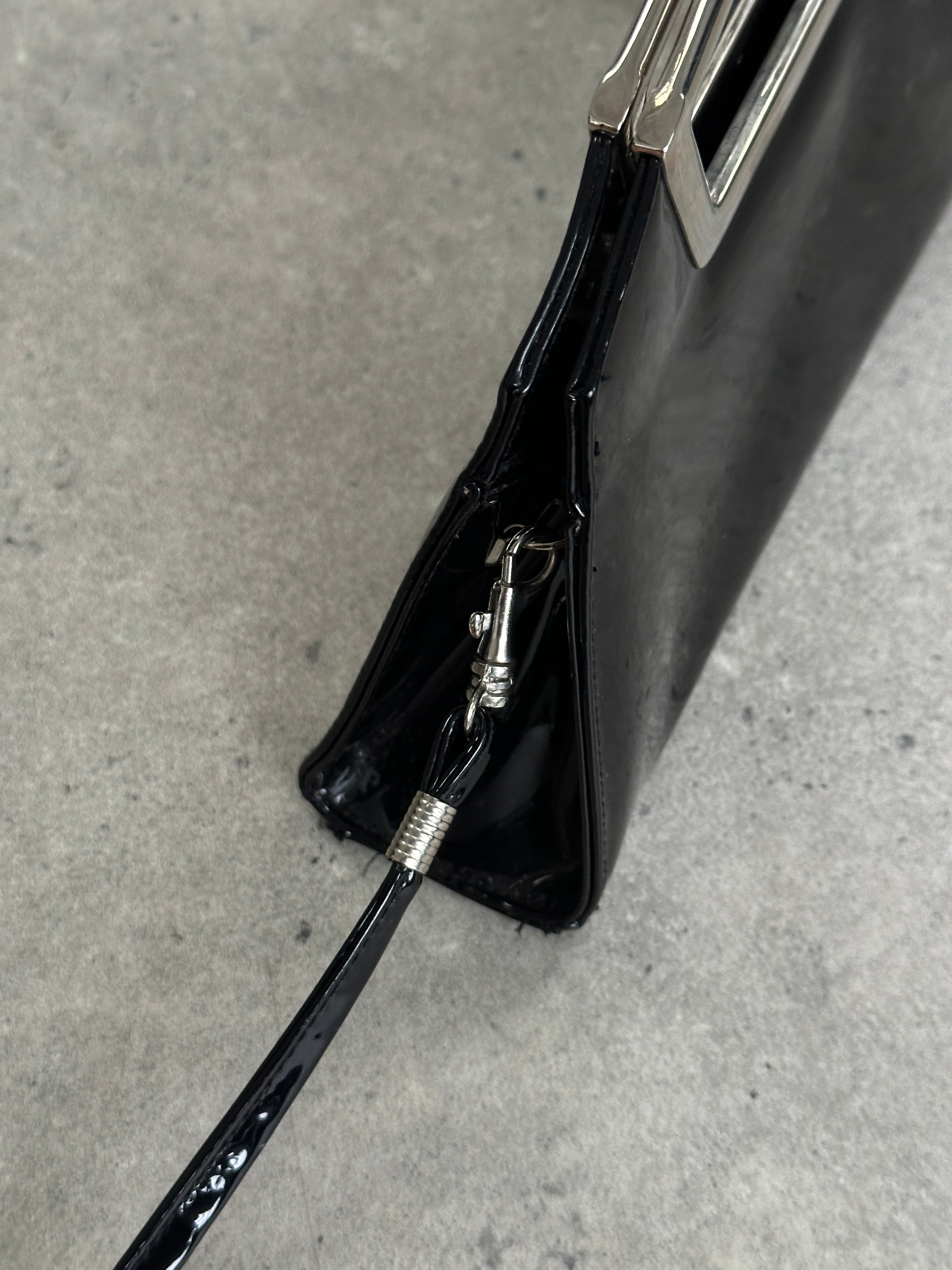 Vintage 2000s patent vinyl chrome crossbody clutch bag with stylish design and sleek metallic finish.