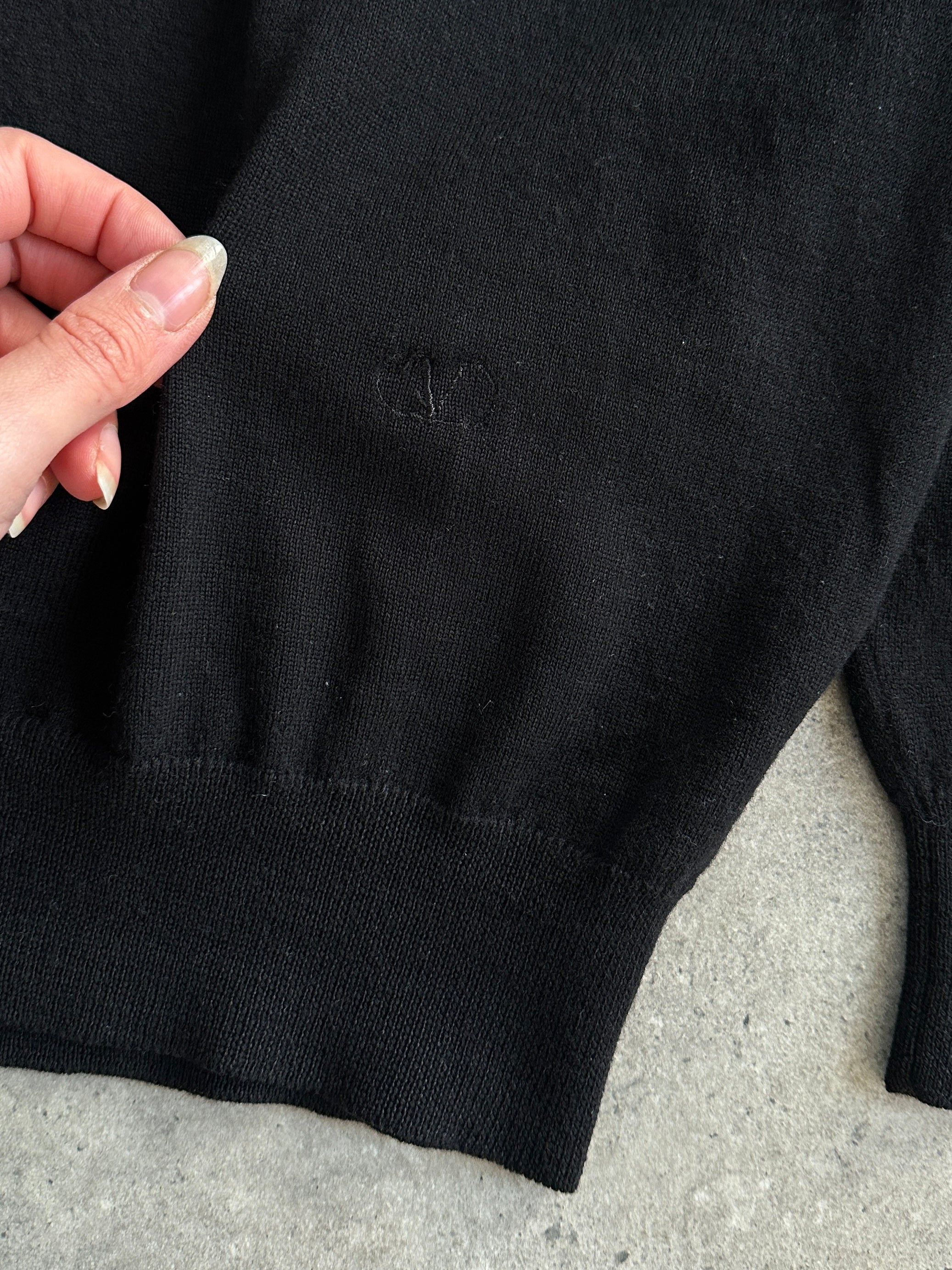 Valentino pure wool logo turtleneck jumper in black, featuring a high neckline and subtle branded logo on the chest.