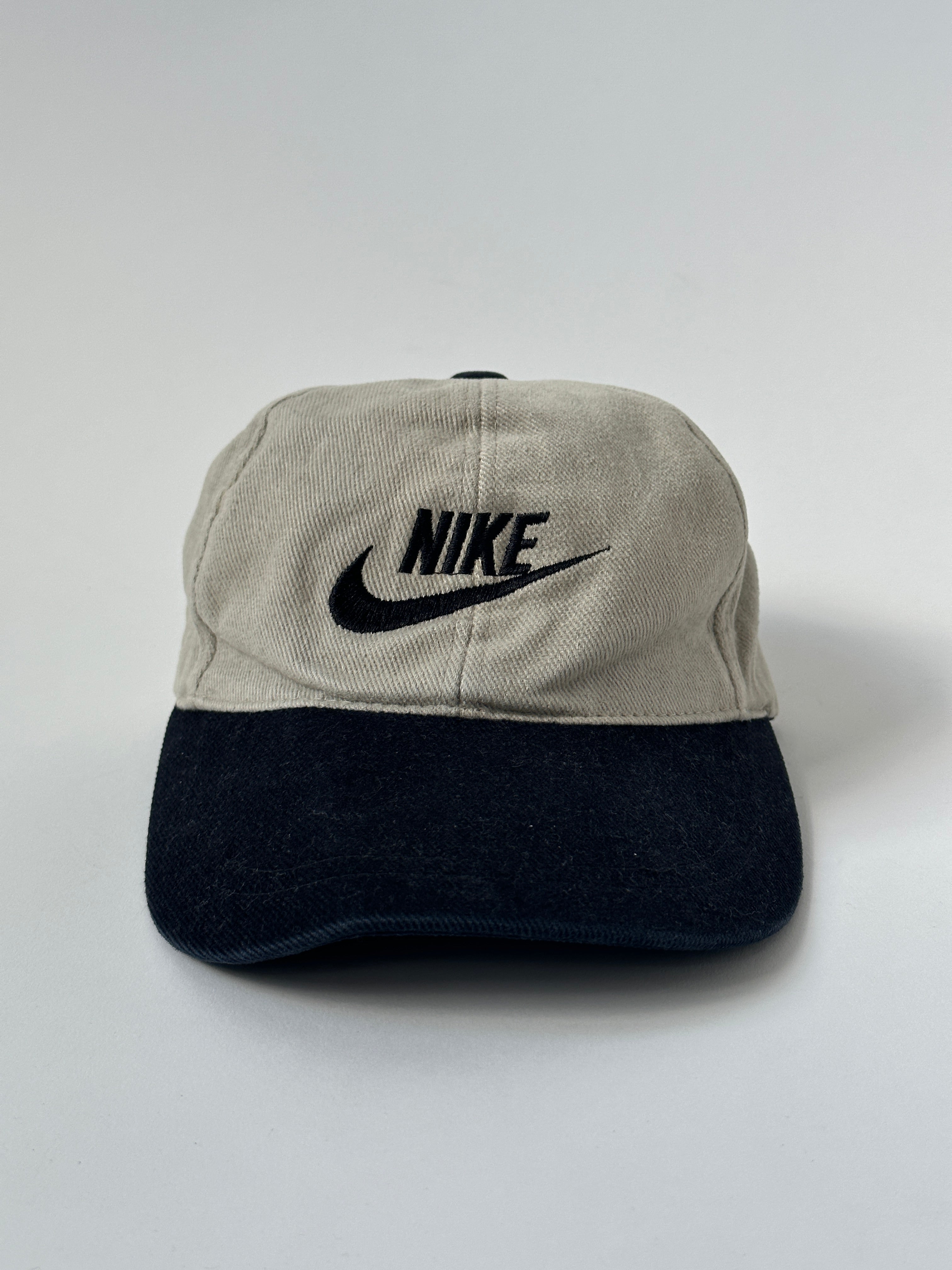 Nike cotton twill baseball cap showing a classic curved brim and adjustable strap, in a neutral color.