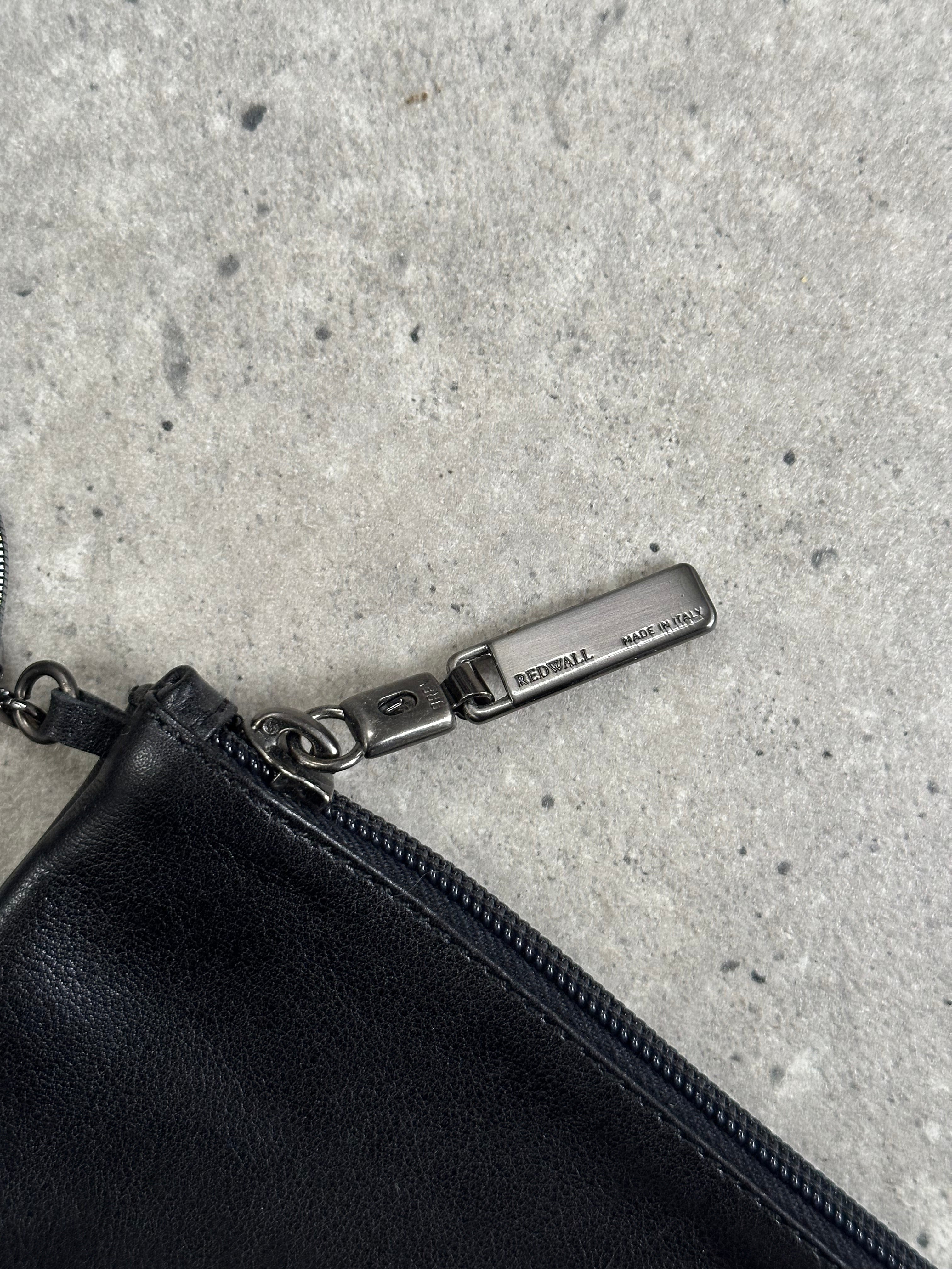Giorgio Armani 2000s leather shoulder bag with sleek design and adjustable strap, featuring classic Armani branding and elegant craftsmanship.