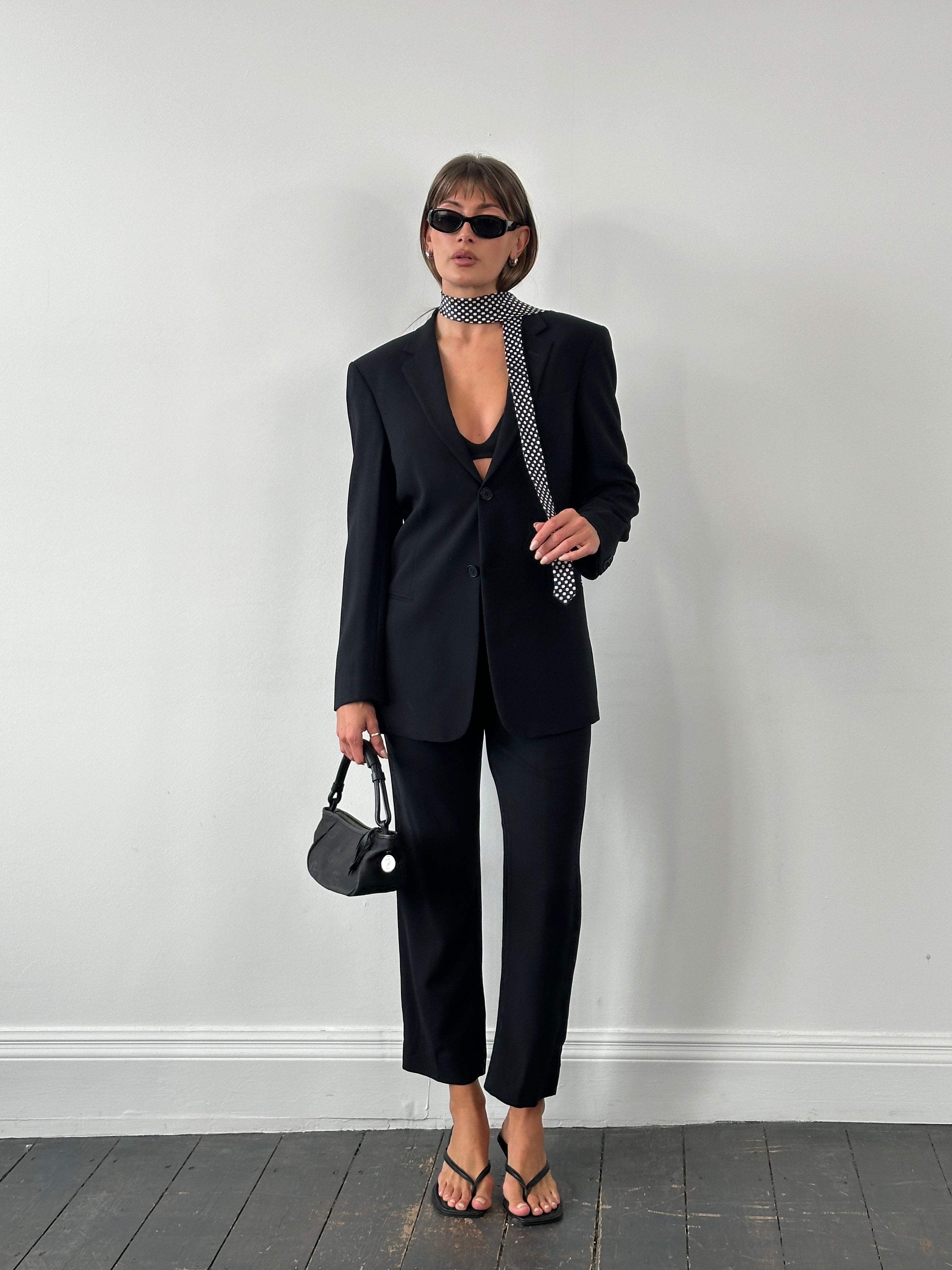 Emporio Armani 1990s pure wool single-breasted suit in size 36R/W28, tailored fit with classic lapels and button closure.