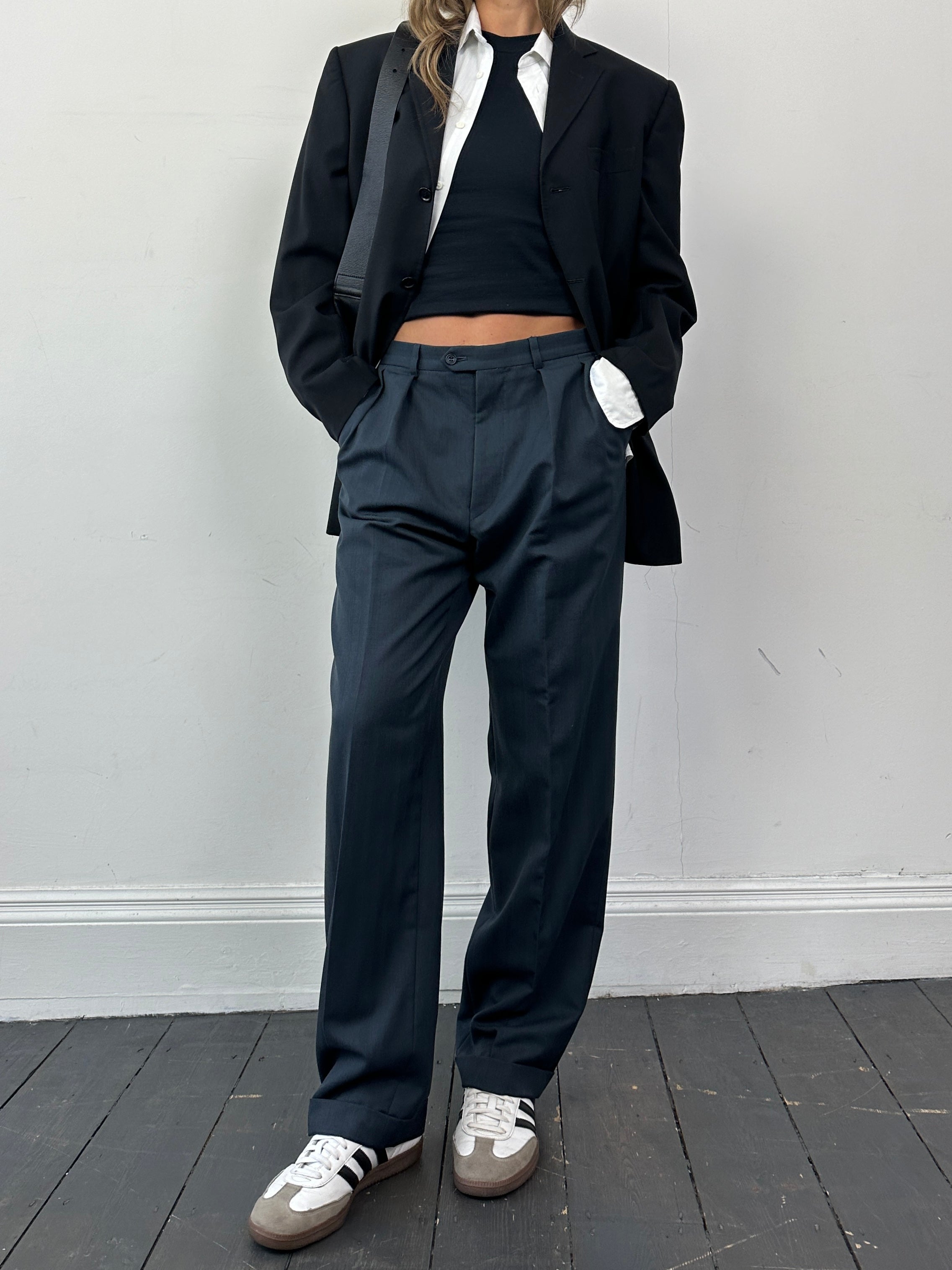 Christian Dior wool tapered leg tailored trousers in W32, shown in a neutral color with a smooth fit and classic design.