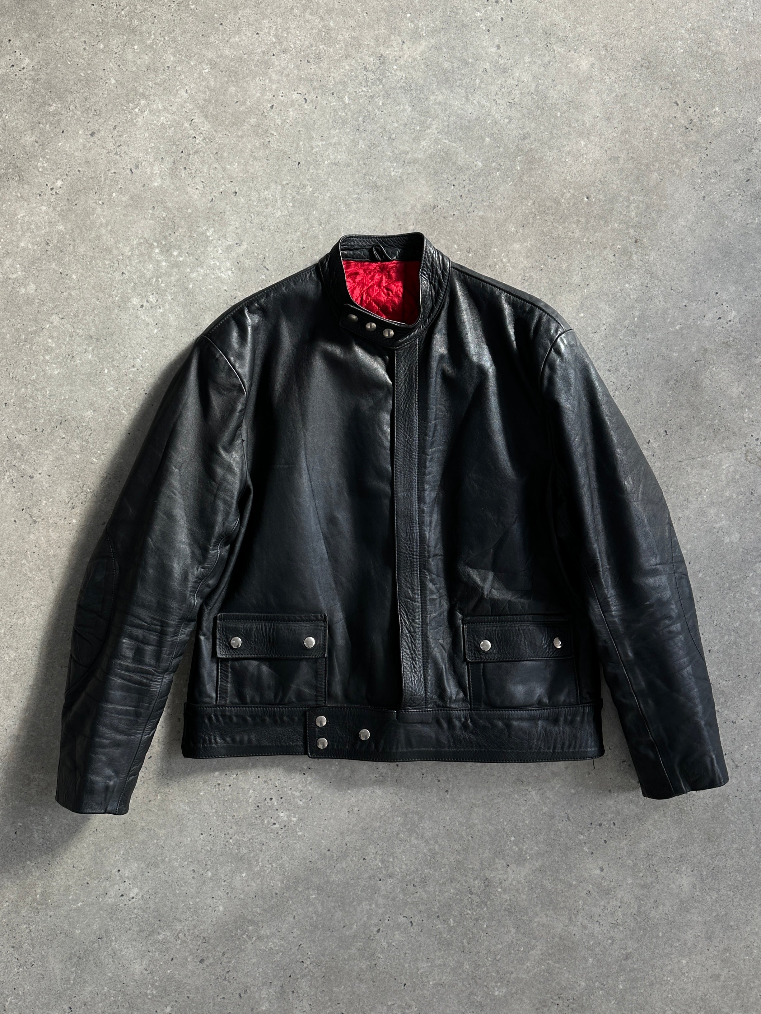 Vintage leather moto jacket in size large, featuring classic design and detailed stitching on a black leather exterior.