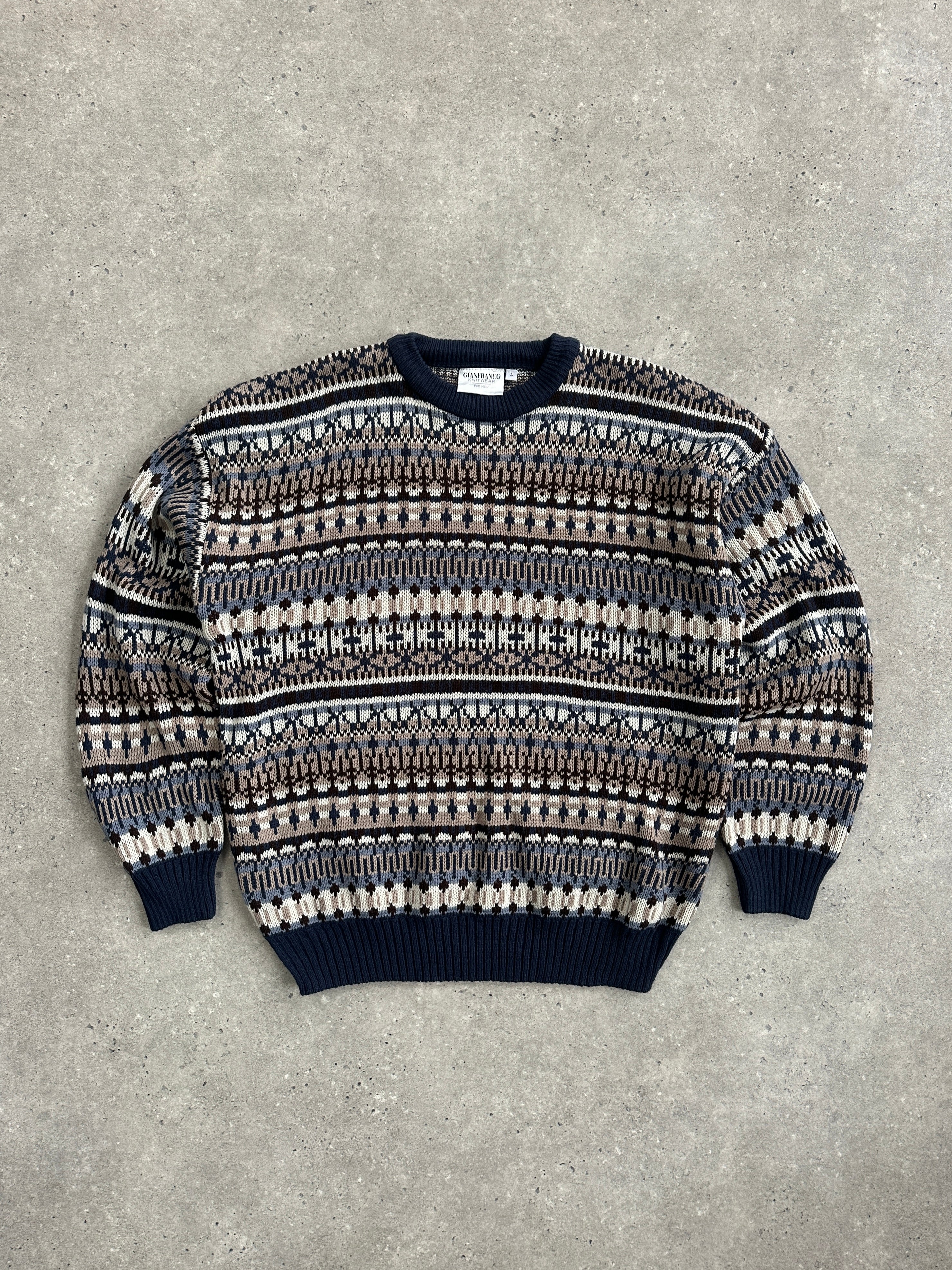 Vintage 1990s Fair Isle knitted jumper in size L/XL, featuring classic multicolor geometric patterns and cozy wool texture.