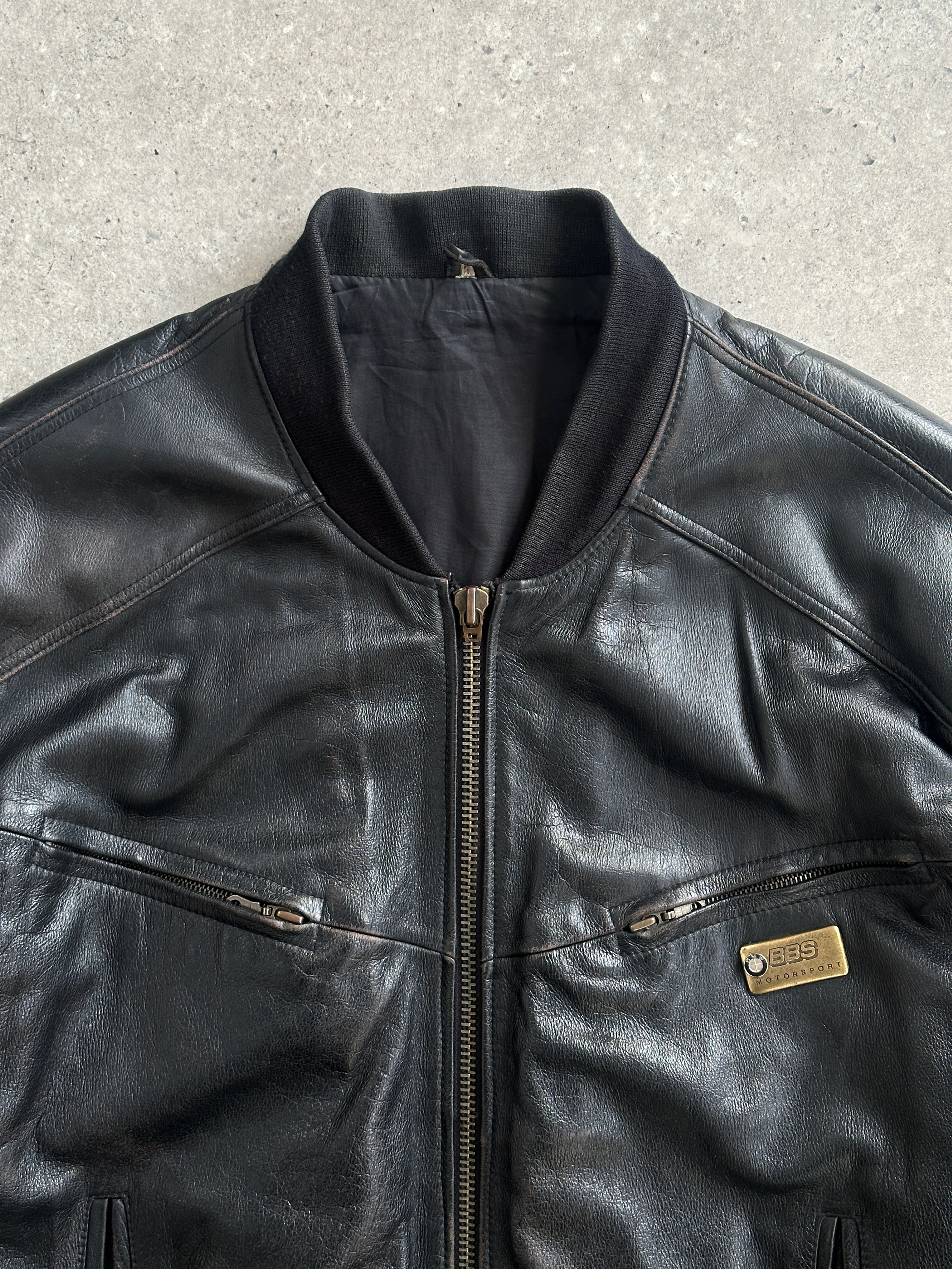 Vintage BMW 1990s leather bomber jacket in XL, featuring classic design, brown leather, and ribbed cuffs and collar.