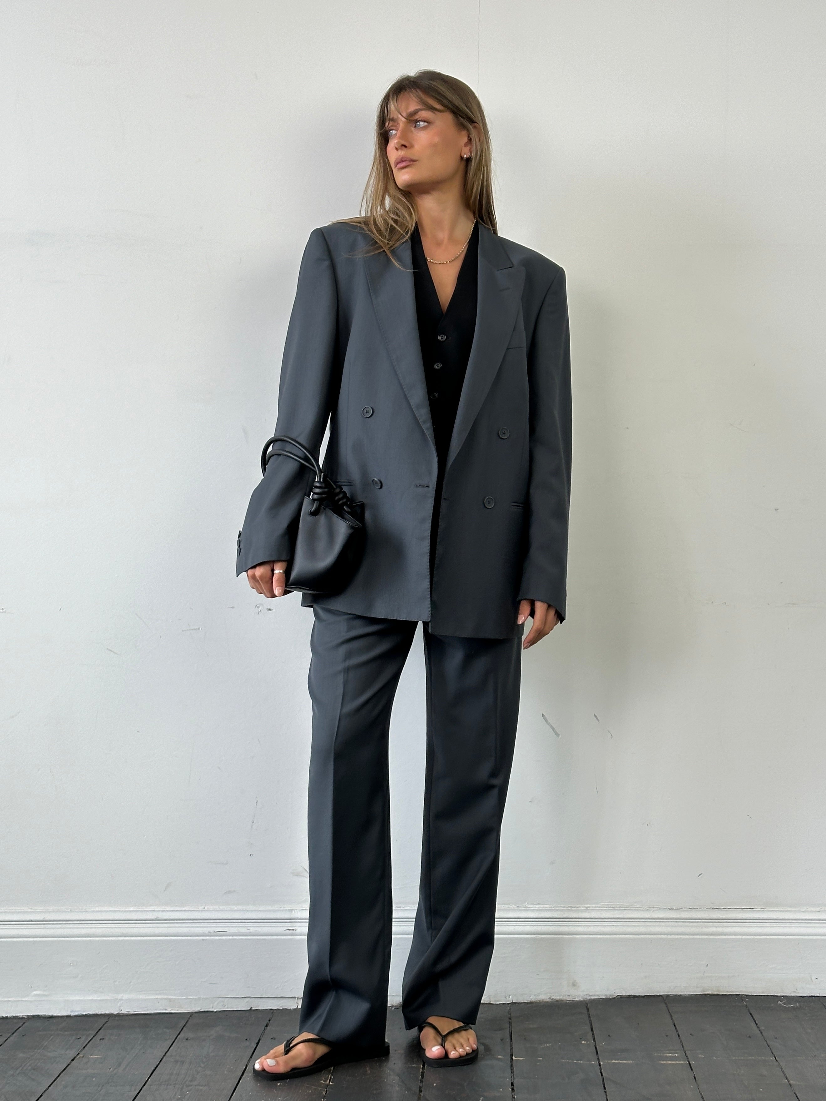 Vintage Italian double-breasted wool blazer in size 40R/W28, classic tailored suit jacket with notch lapels and button details.