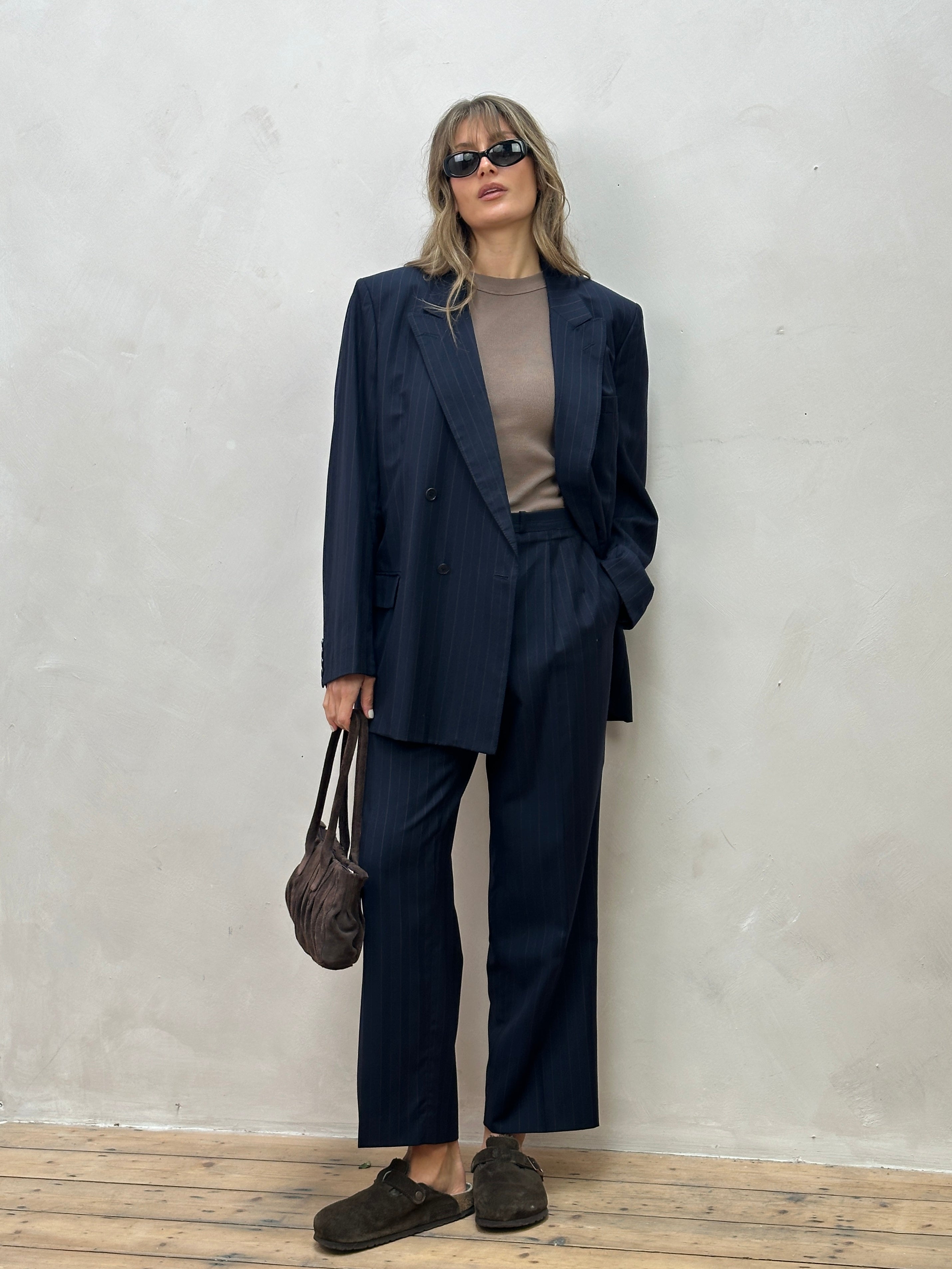 Christian Dior pinstripe pure wool double-breasted jumpsuit in size 44R/W34, featuring tailored lapels and classic fit.