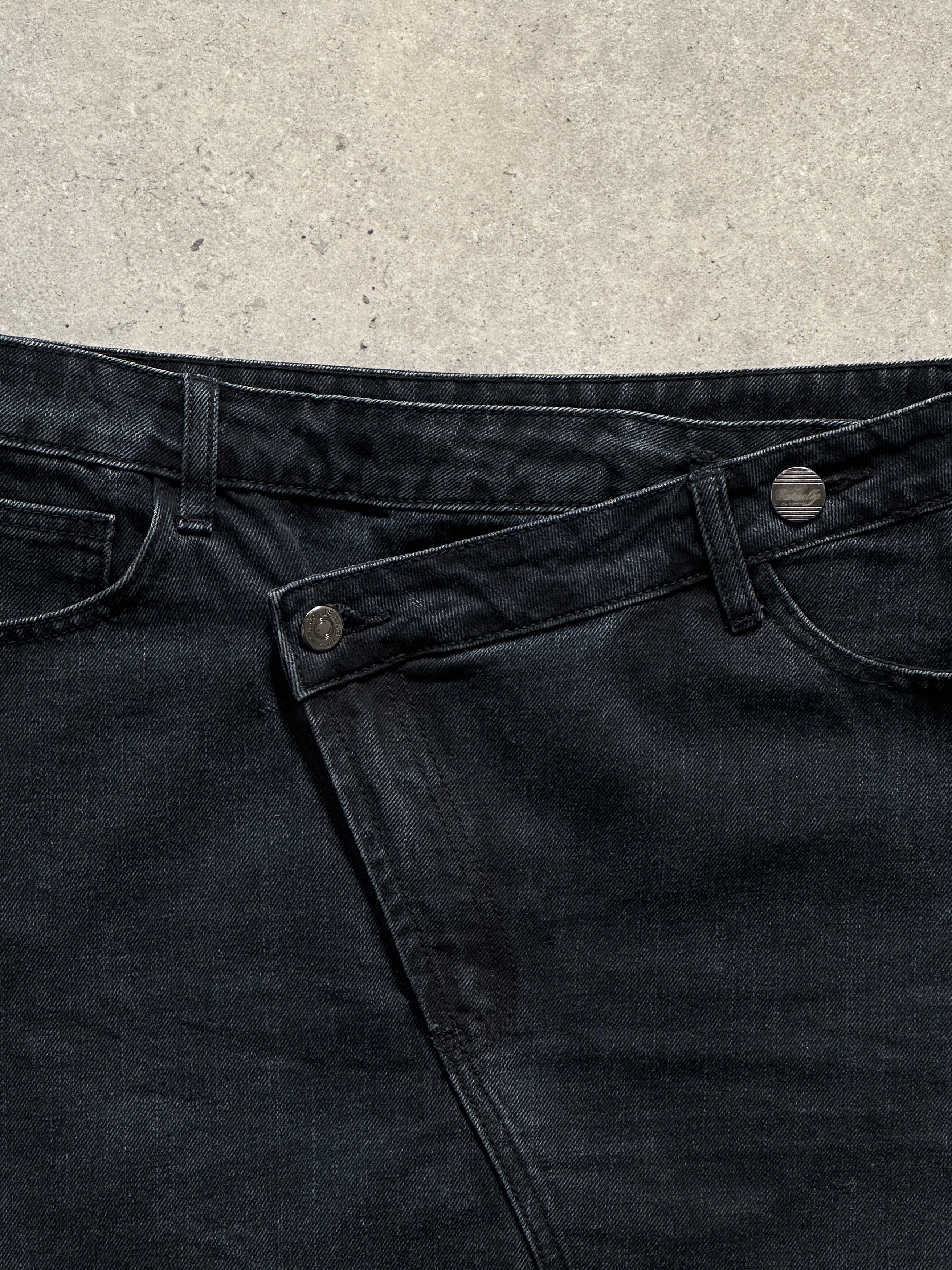 Vintage asymmetrical denim mini skirt with distressed details, front and side view, W32 size, casual fashion style.