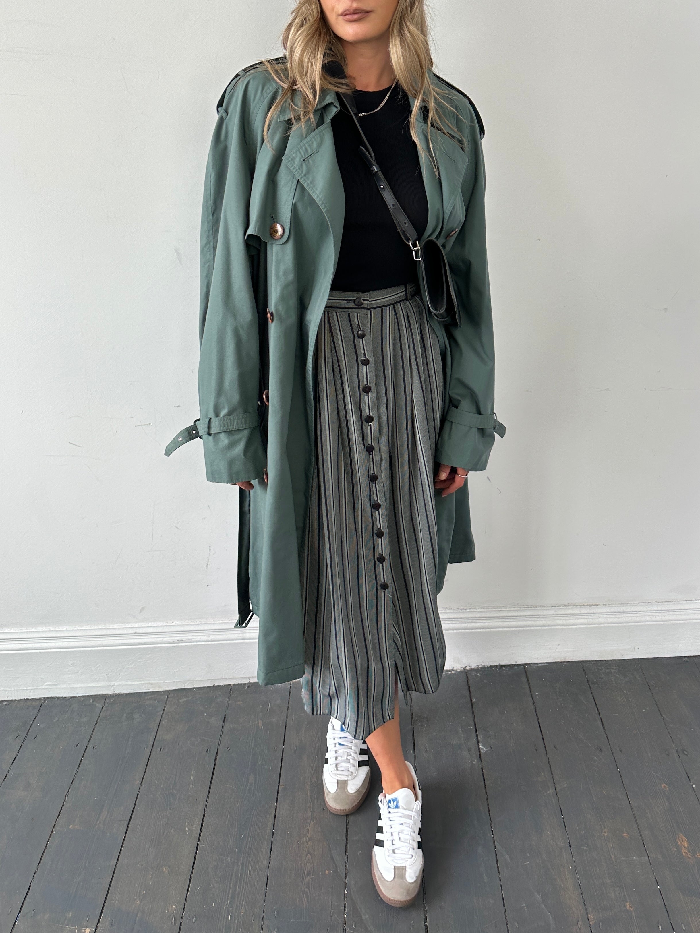 Vintage British vintage stripe maxi skirt in W26 style, featuring bold colorful horizontal stripes and a flowing design.