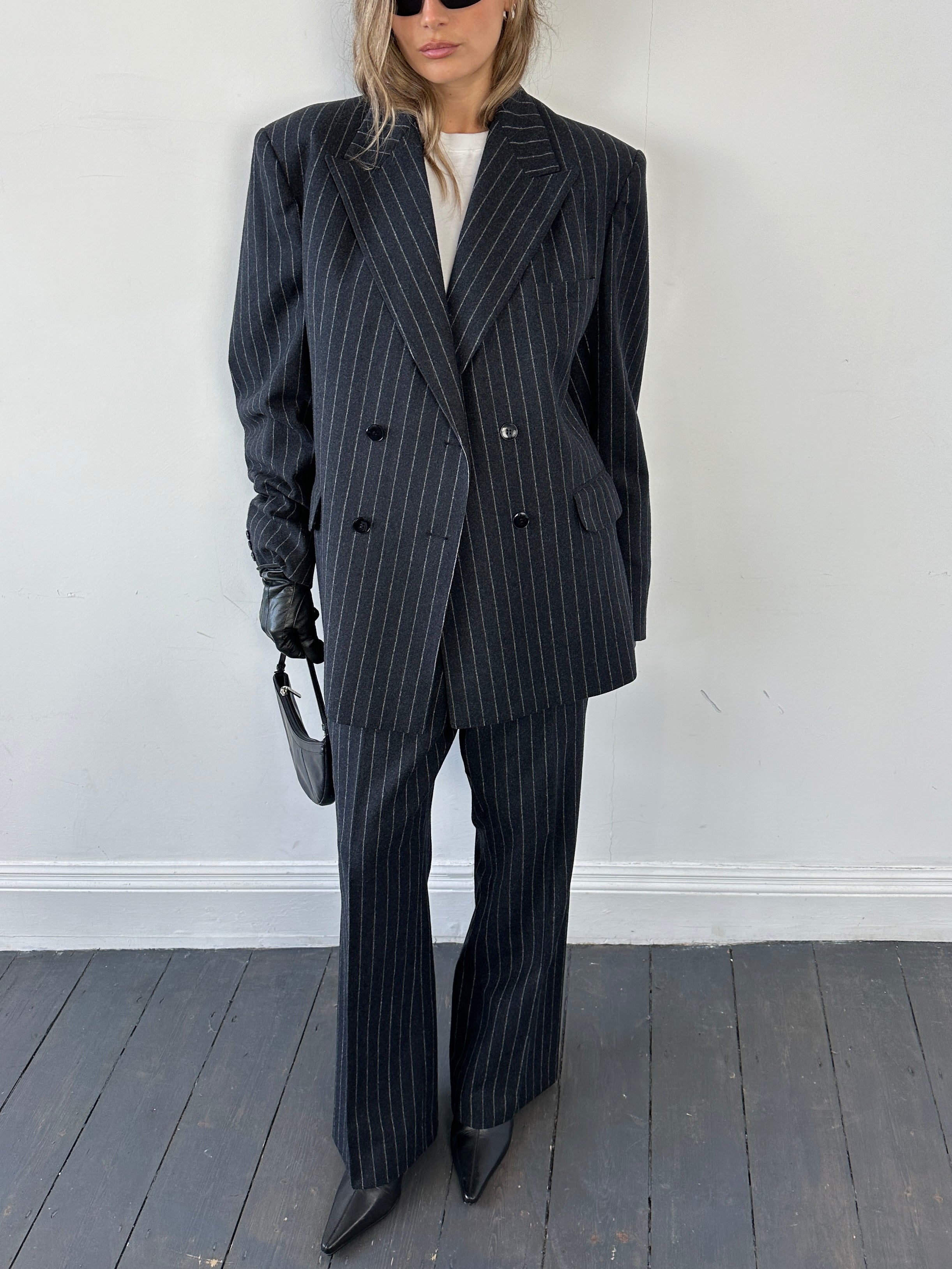 Christian Dior pure wool double-breasted pinstripe jumpsuit in size 45L/W32, tailored with classic pinstripe pattern.