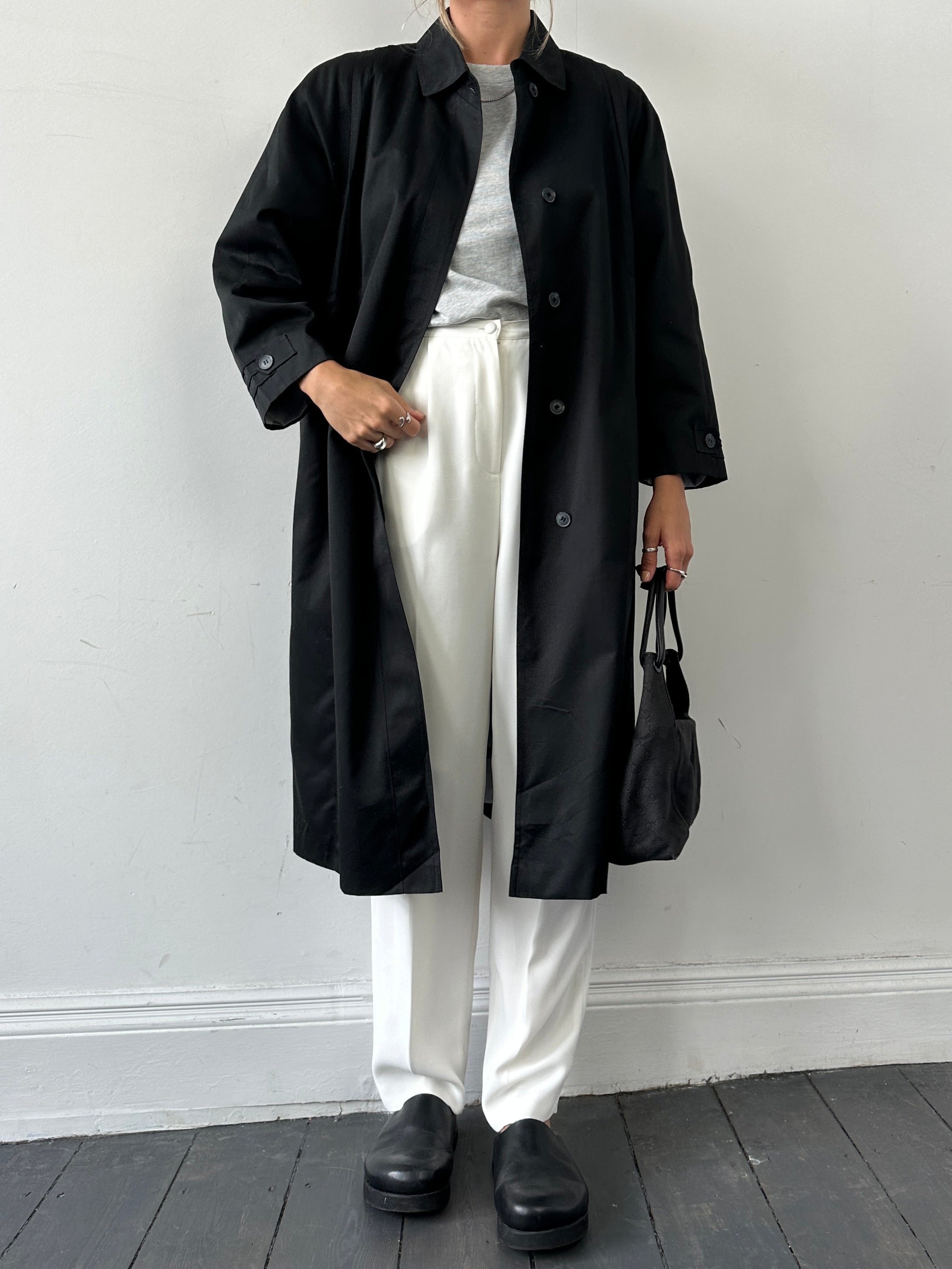 Vintage pleated cotton trench coat in size M, featuring classic design and lightweight fabric, displayed on a hanger.