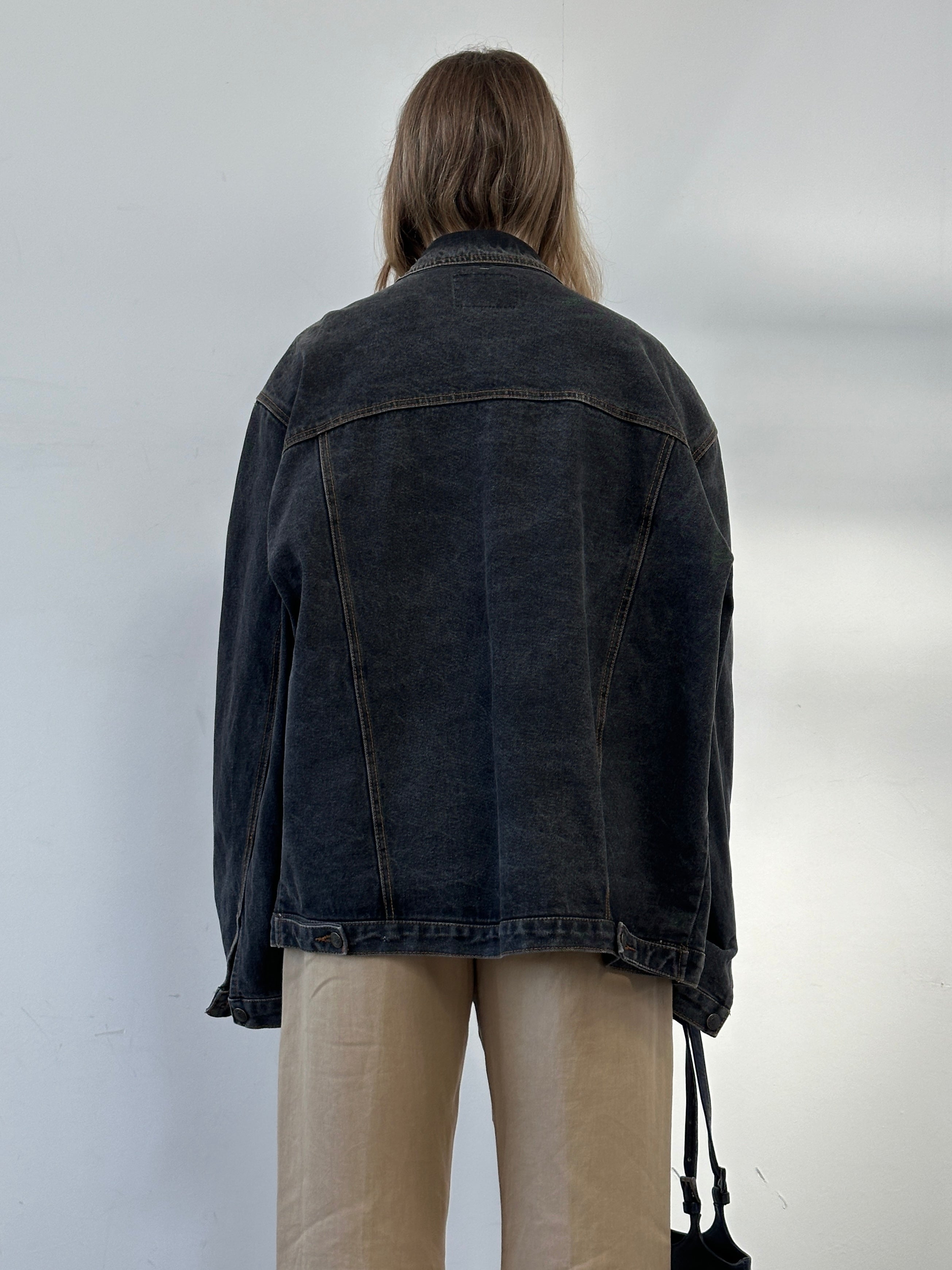 Vintage oversized washed denim jacket in XXL with distressed details, classic denim jacket style, and faded blue finish.