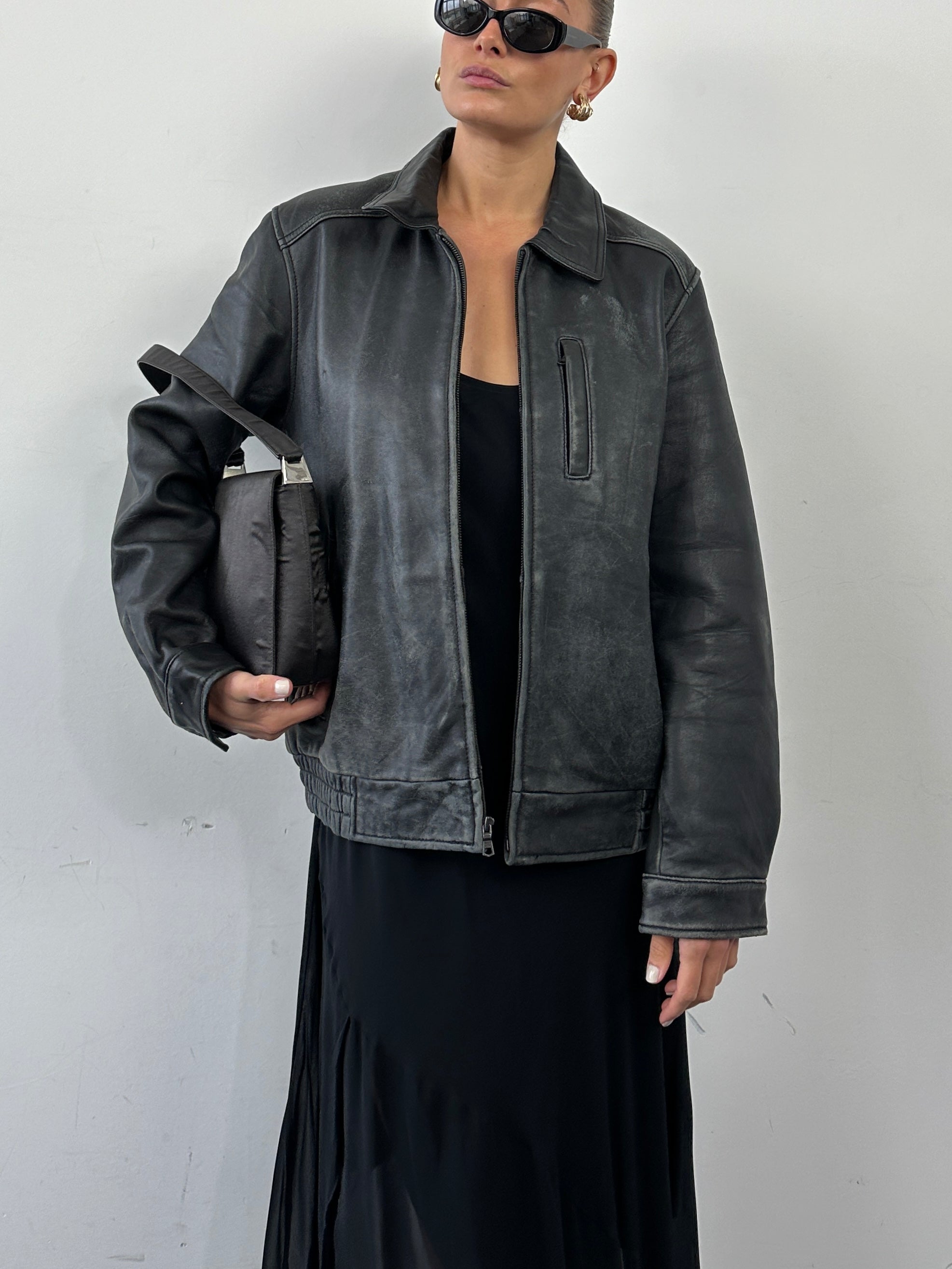 Tommy Hilfiger distressed leather bomber jacket in size M, featuring a rugged design and classic silhouette.