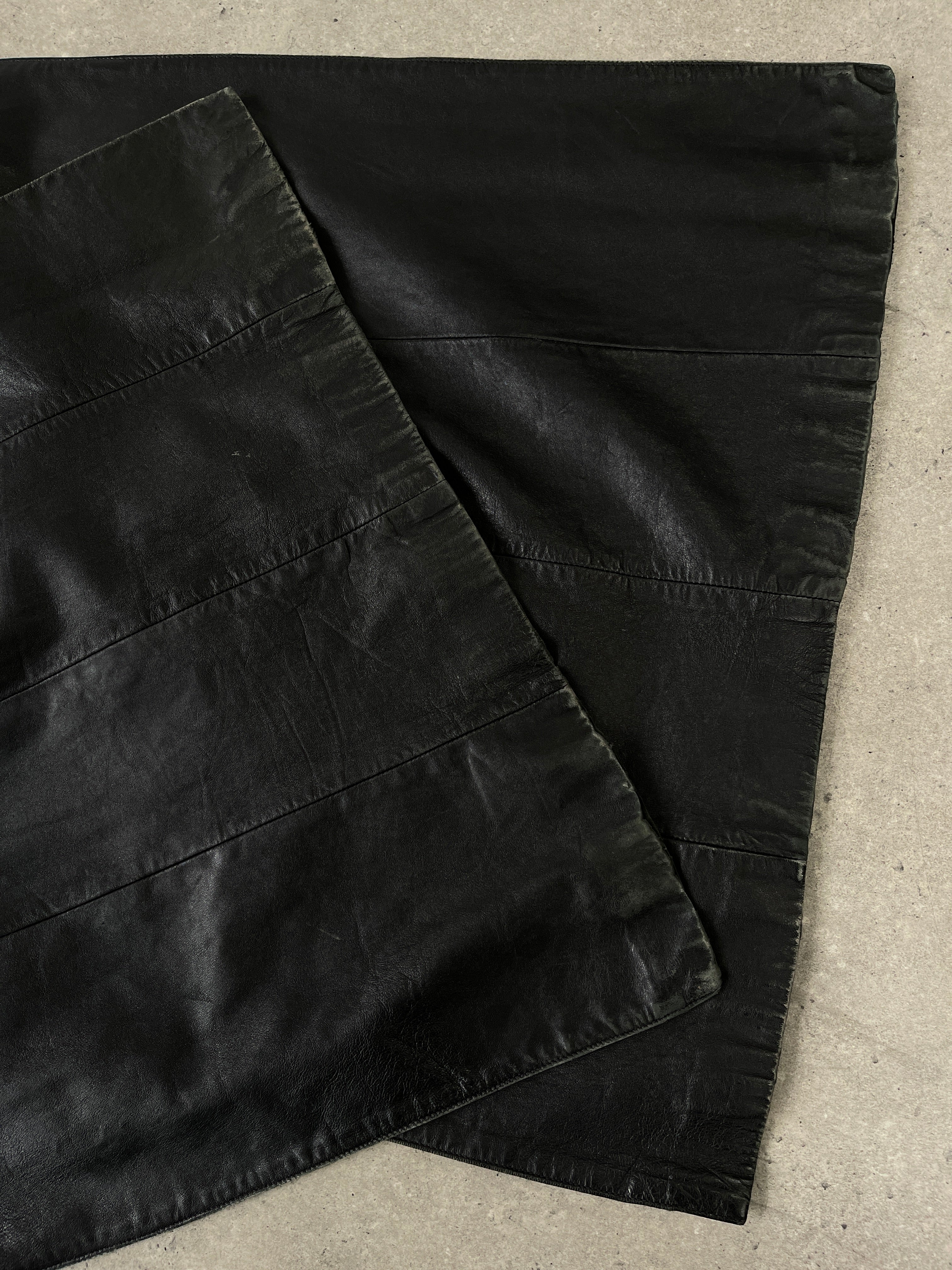 Vintage 1990s floor-length leather trench coat in S/M, classic leather jacket style with a timeless vintage design.