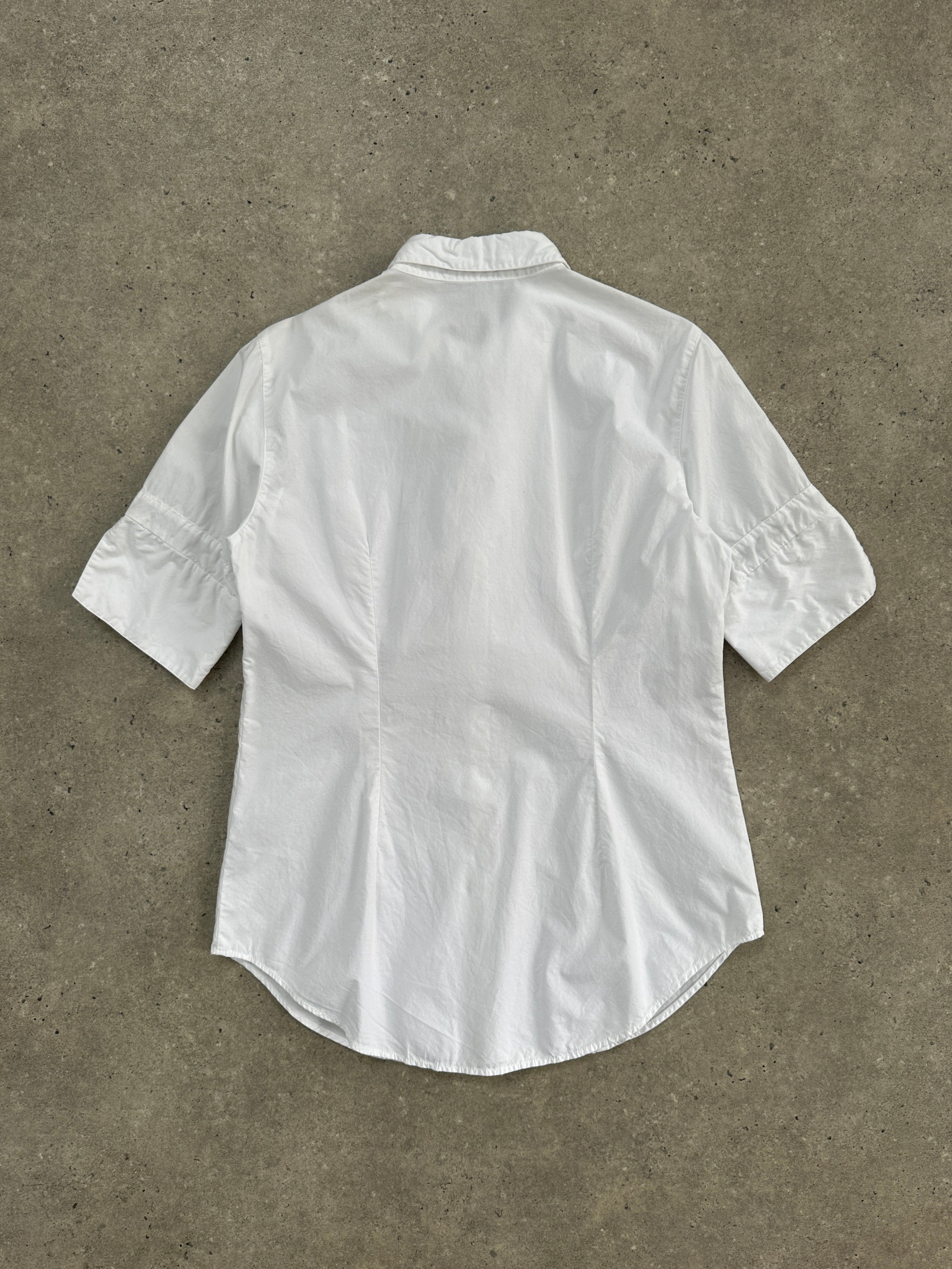 Vintage 1990s short sleeve ruffle shirt in size M, featuring a lightweight fabric with a feminine ruffle detail and classic fit.