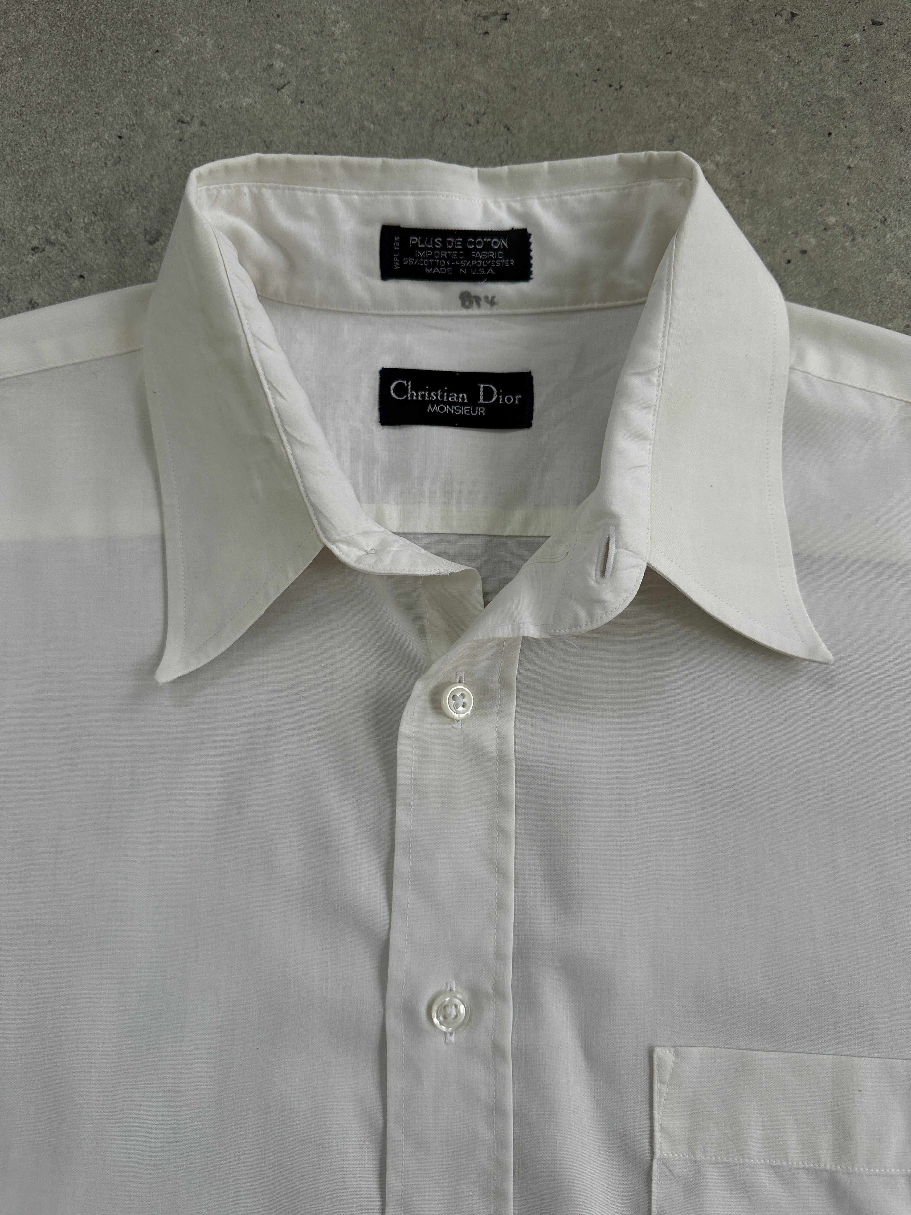 Christian Dior Monsieur 1990s cotton shirt in size L, shown on a hanger with a classic collar and button-down front.