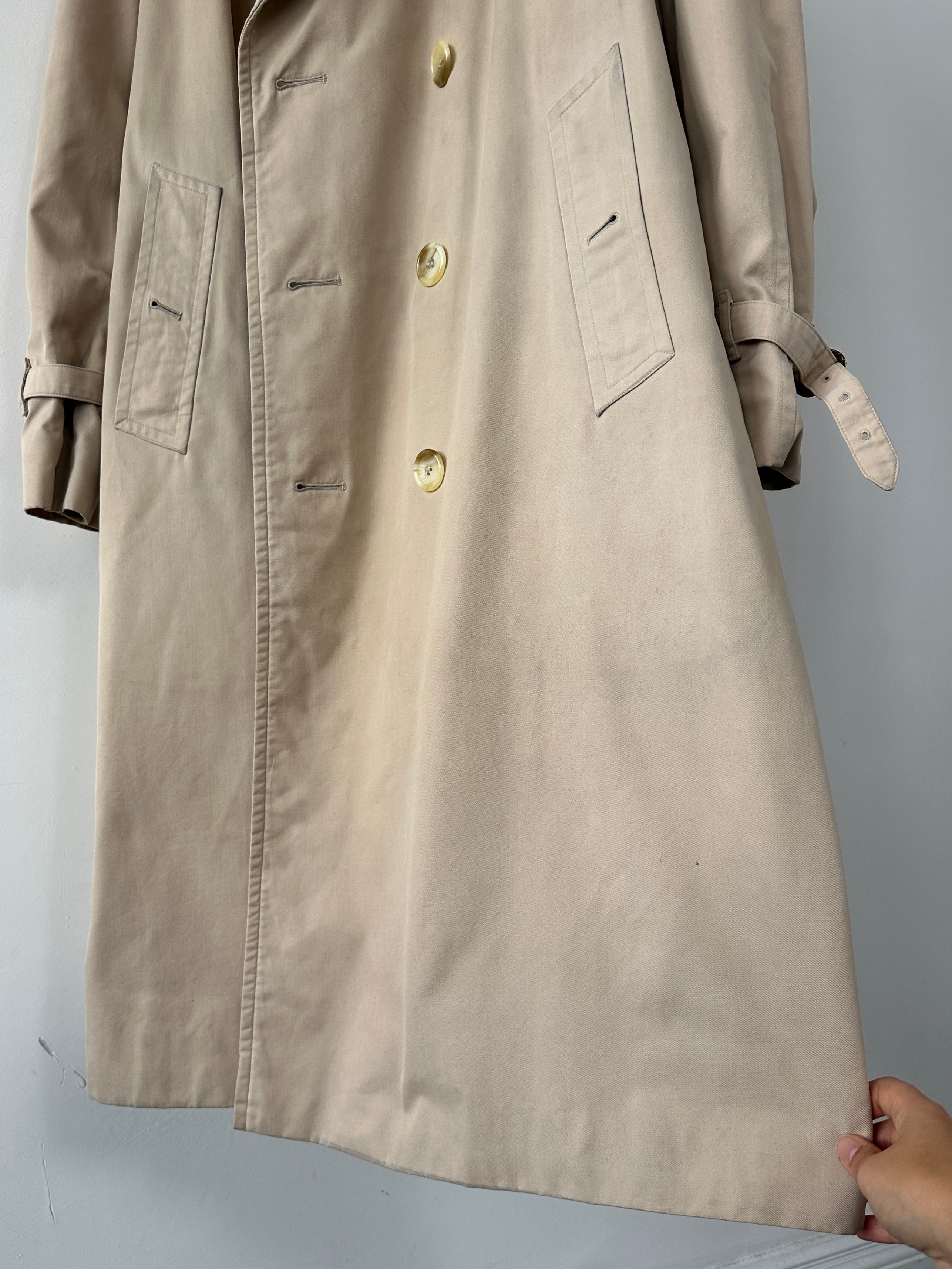 Burberry double breasted trench coat in XL size, beige color, showcasing classic design and button details.