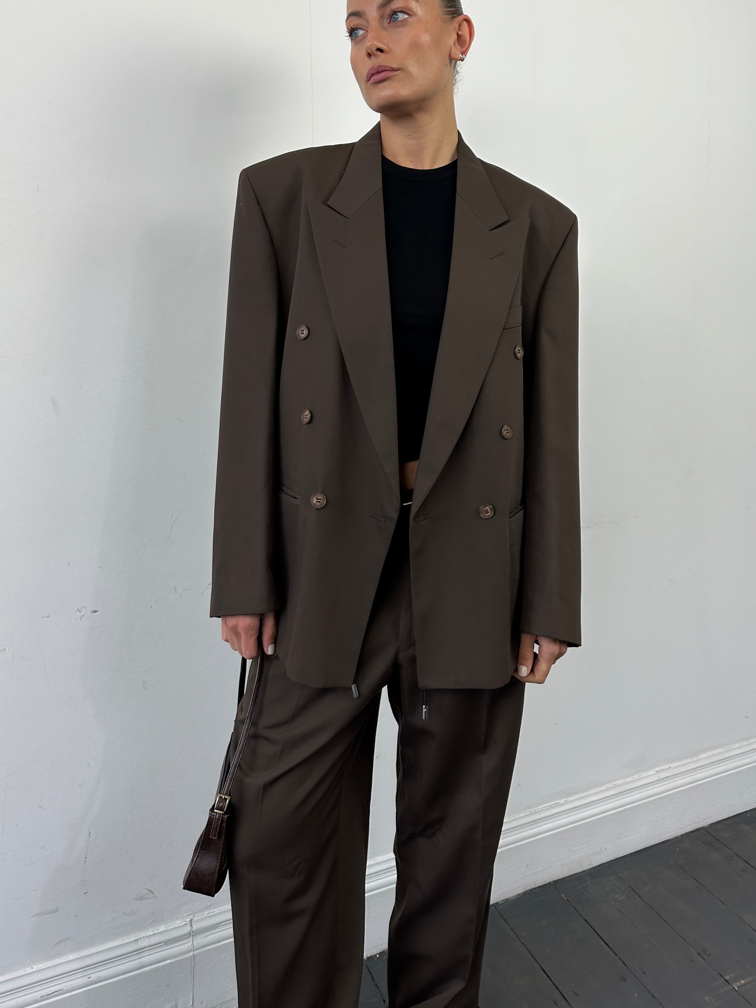 Vintage double-breasted suit jumpsuit in size 40R/W32, with tailored fit and classic style, photographed against a neutral background.