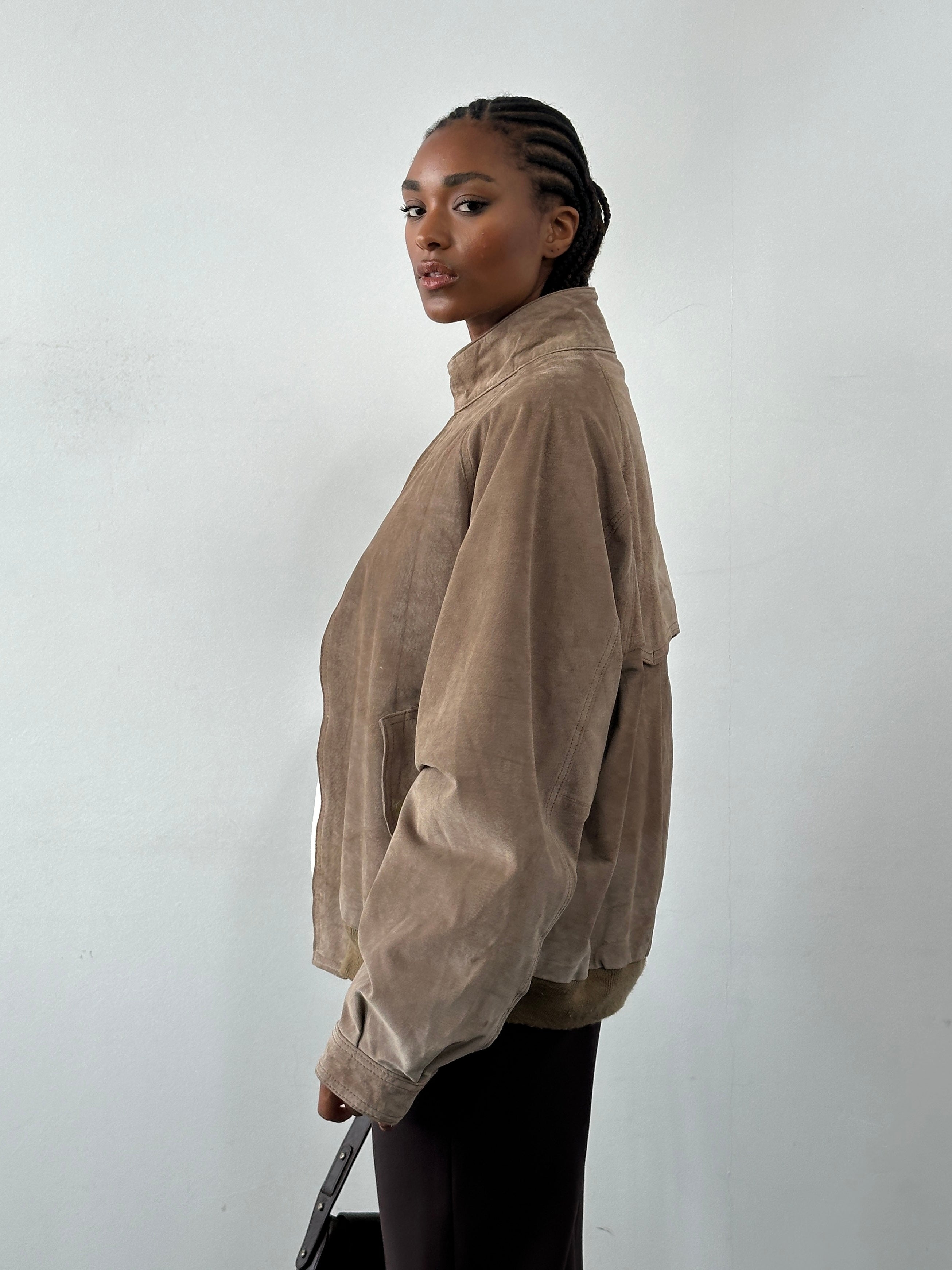 Vintage 1990s high neck suede bomber jacket in XL, featuring classic design and rich suede texture.