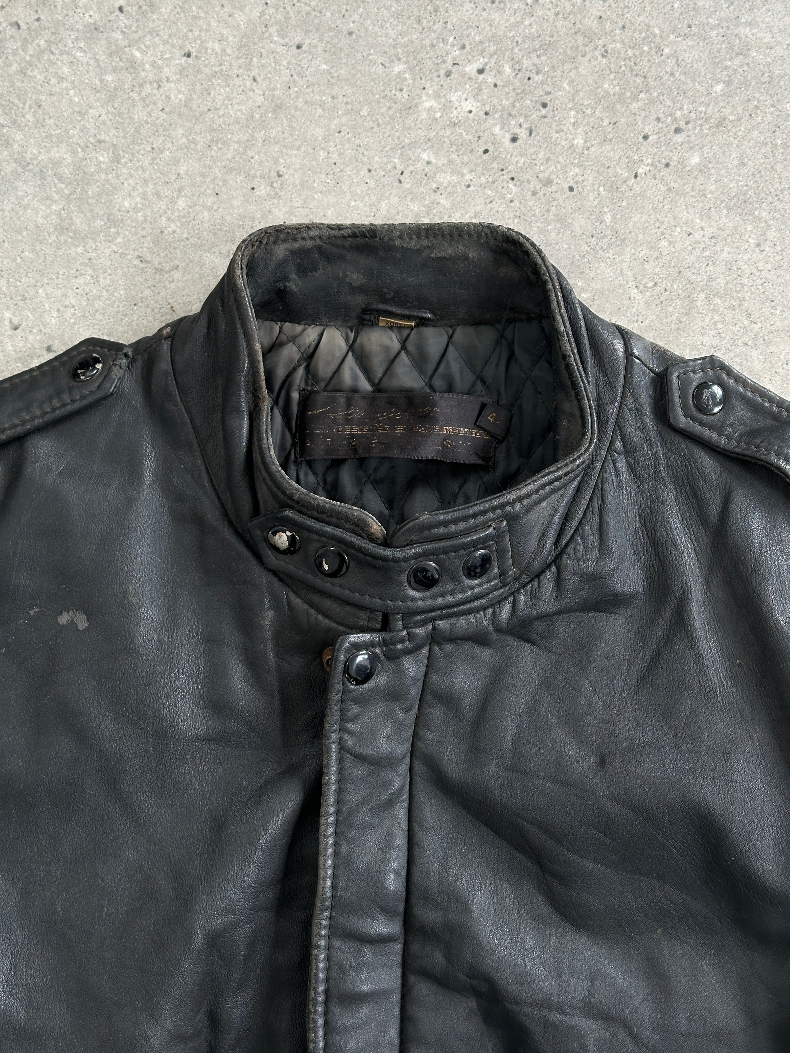 Vintage distressed leather bomber jacket, men's M/L size, featuring rugged style and classic design.