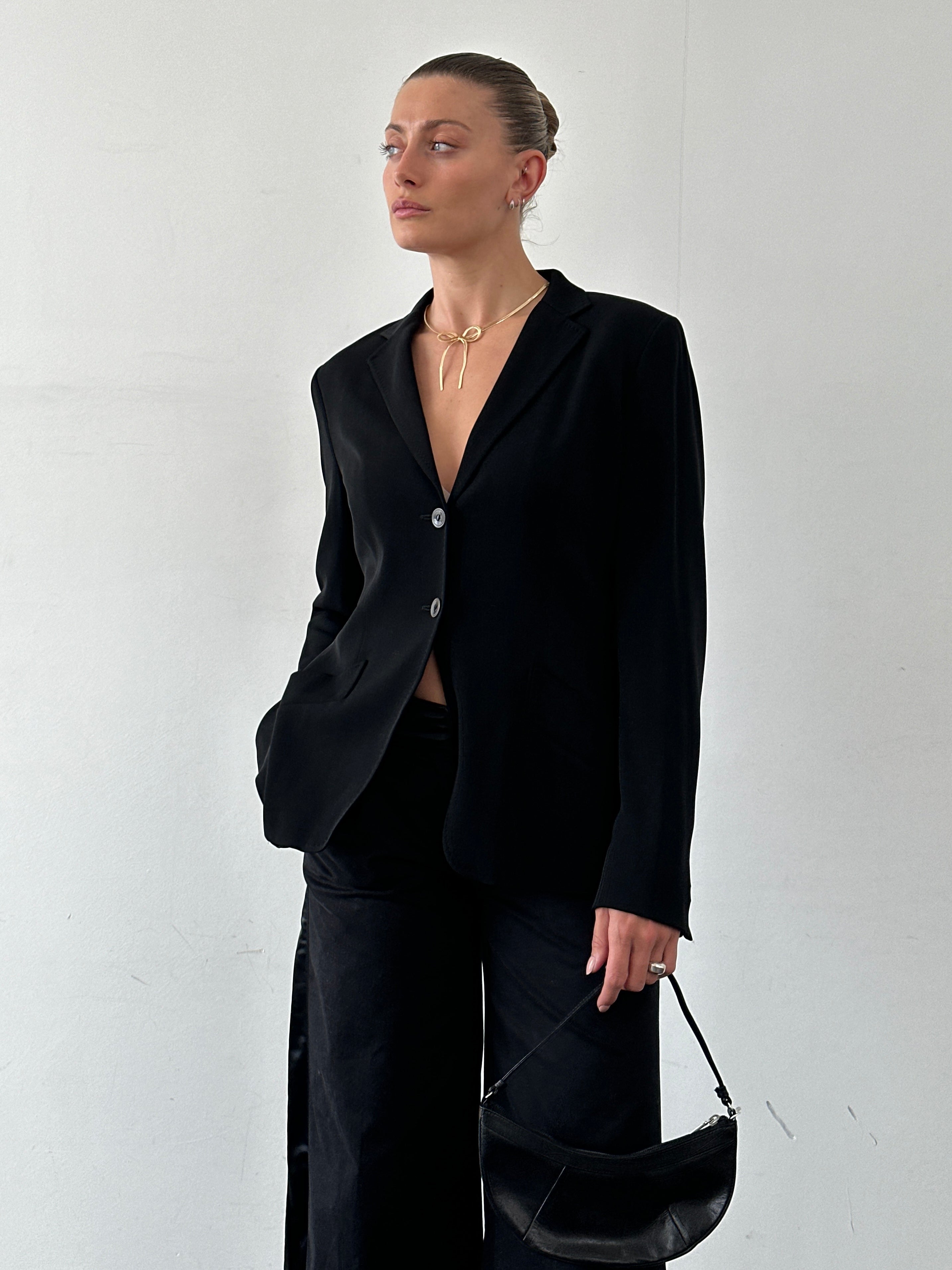 Max Mara wool silk single-breasted blazer in size M, tailored fit with lapels and button closure, displayed on a hanger.