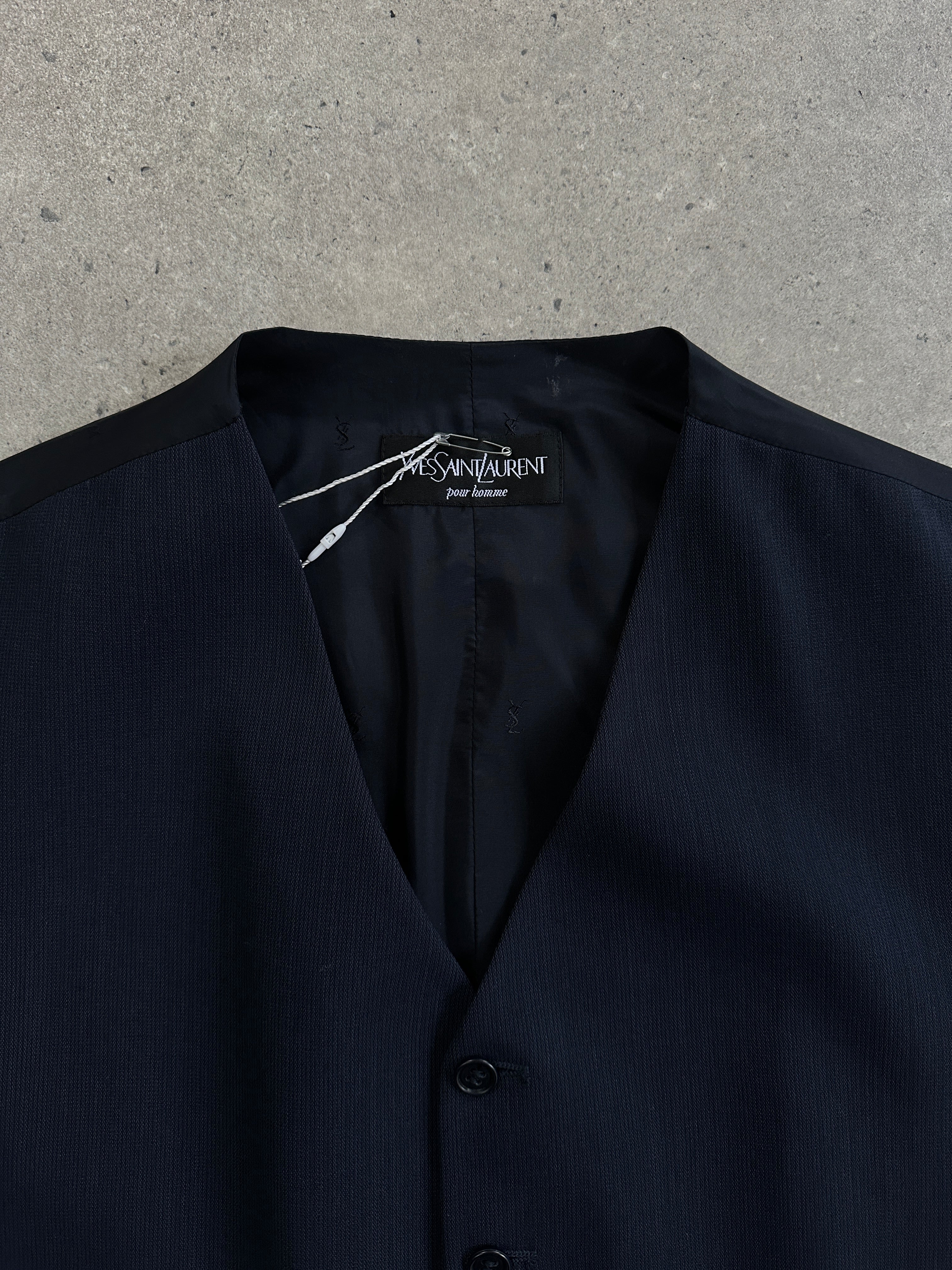 Yves Saint Laurent Pour Homme wool tailored waistcoat in size 42R/L, featuring a classic design with a button closure and lapel collar.