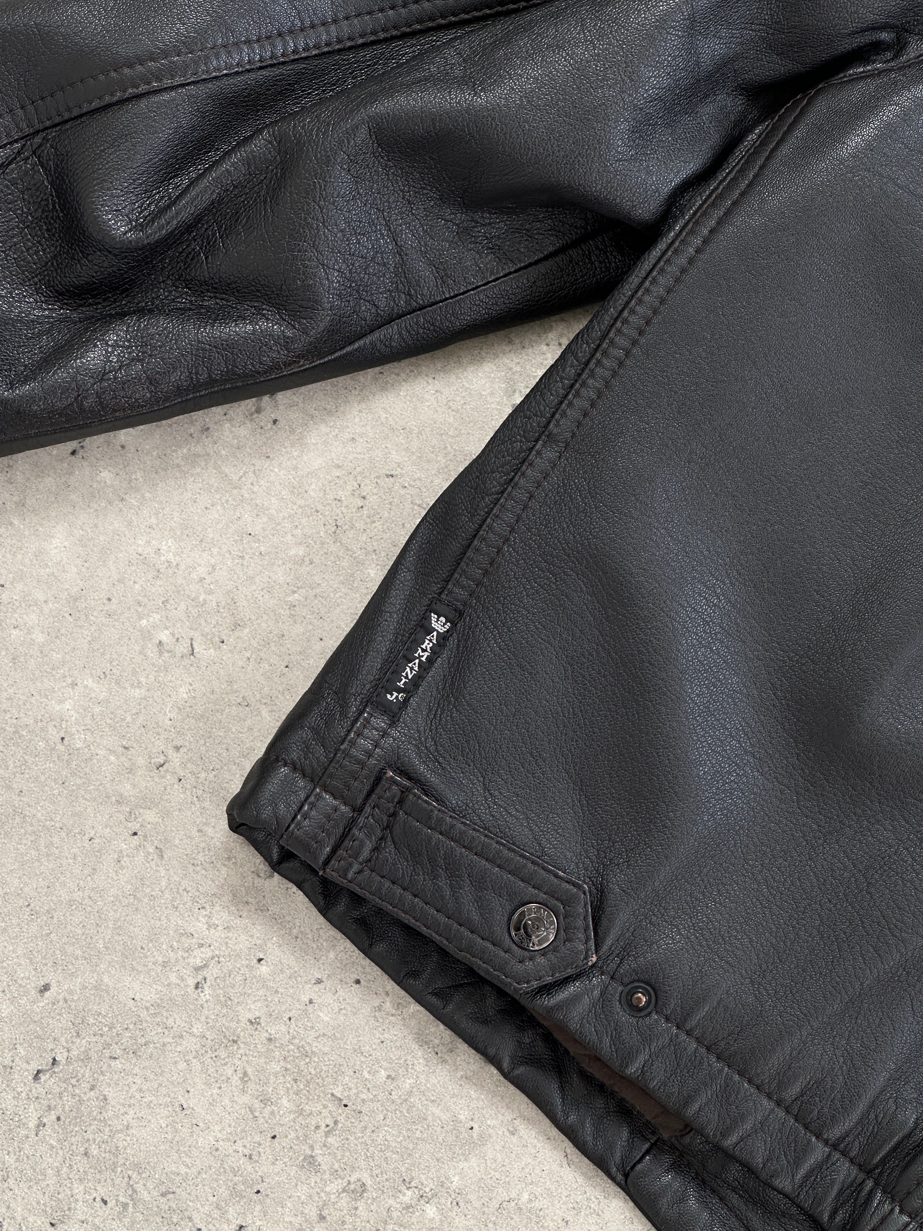 Armani Jeans leather jacket in size S/M, stylish black leather with a sleek fit and classic design.