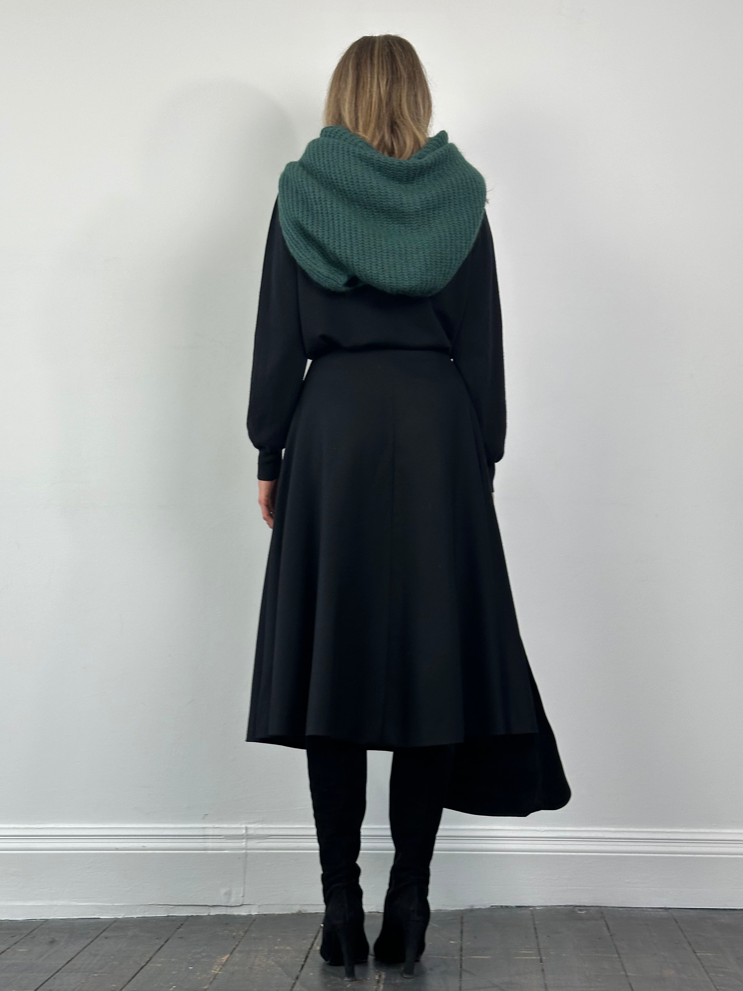 Vintage brand brushed wool A-line skirt in neutral tones, showcasing a classic, vintage-inspired design with a fitted waist and flared hem.