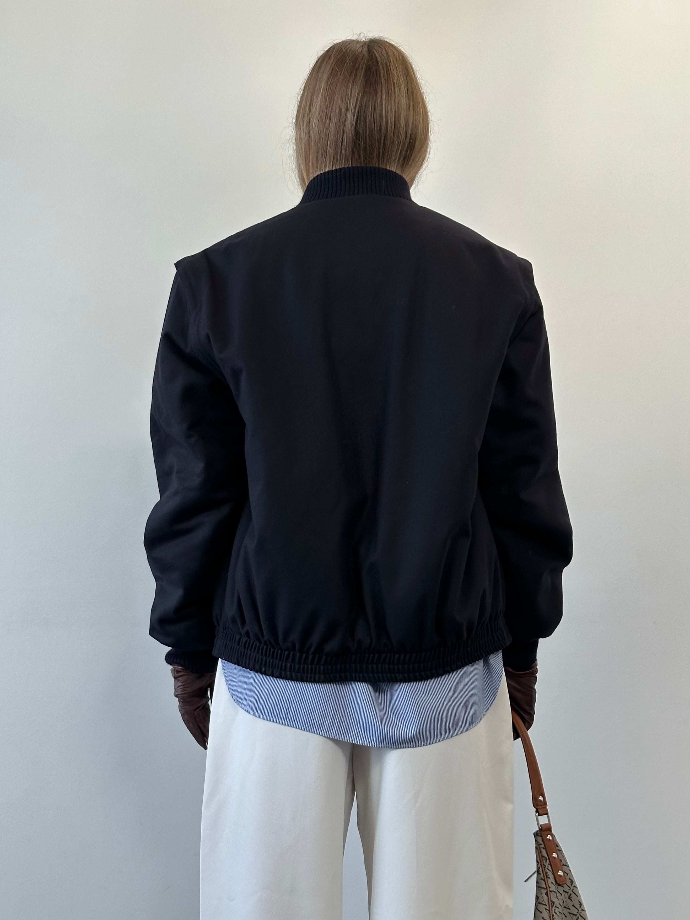 Italian vintage wool bomber jacket in size L, featuring classic design and warm wool fabric, displayed on a neutral background.