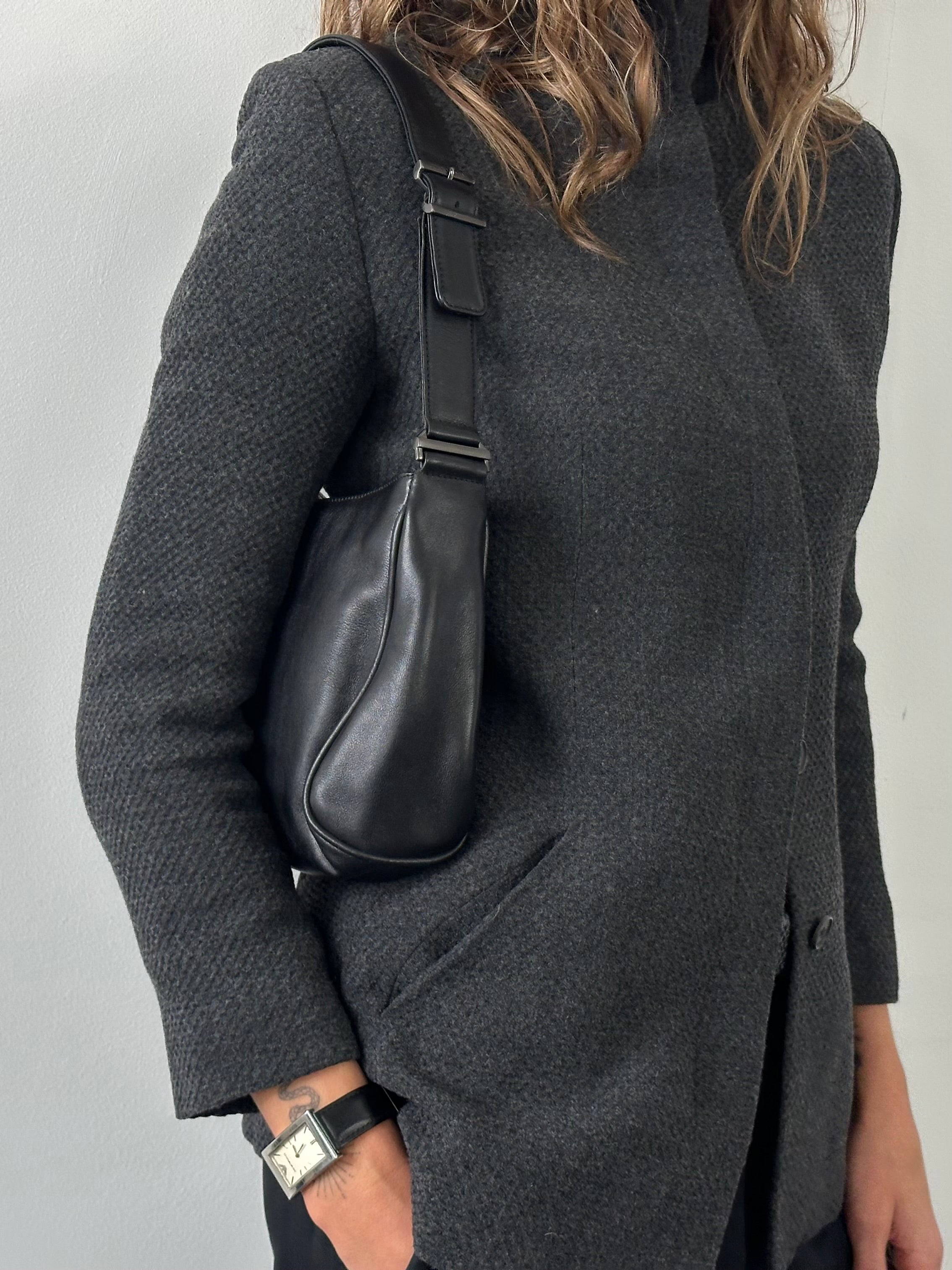 Giorgio Armani 2000s leather shoulder bag with sleek design, brown leather exterior, and adjustable shoulder strap.