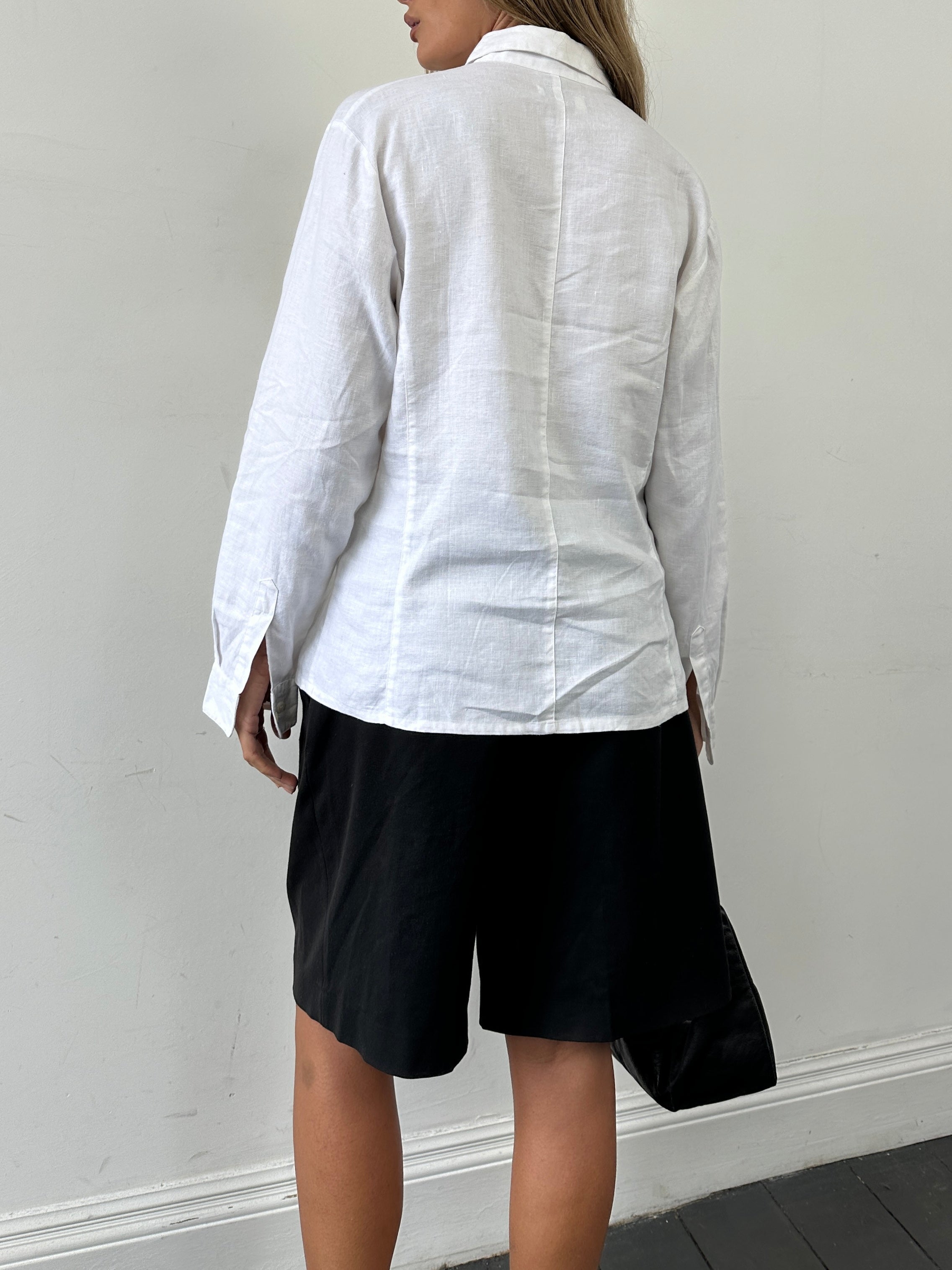 Vintage pure linen concealed placket shirt in size M, featuring a classic collar and long sleeves, displayed on a hanger.