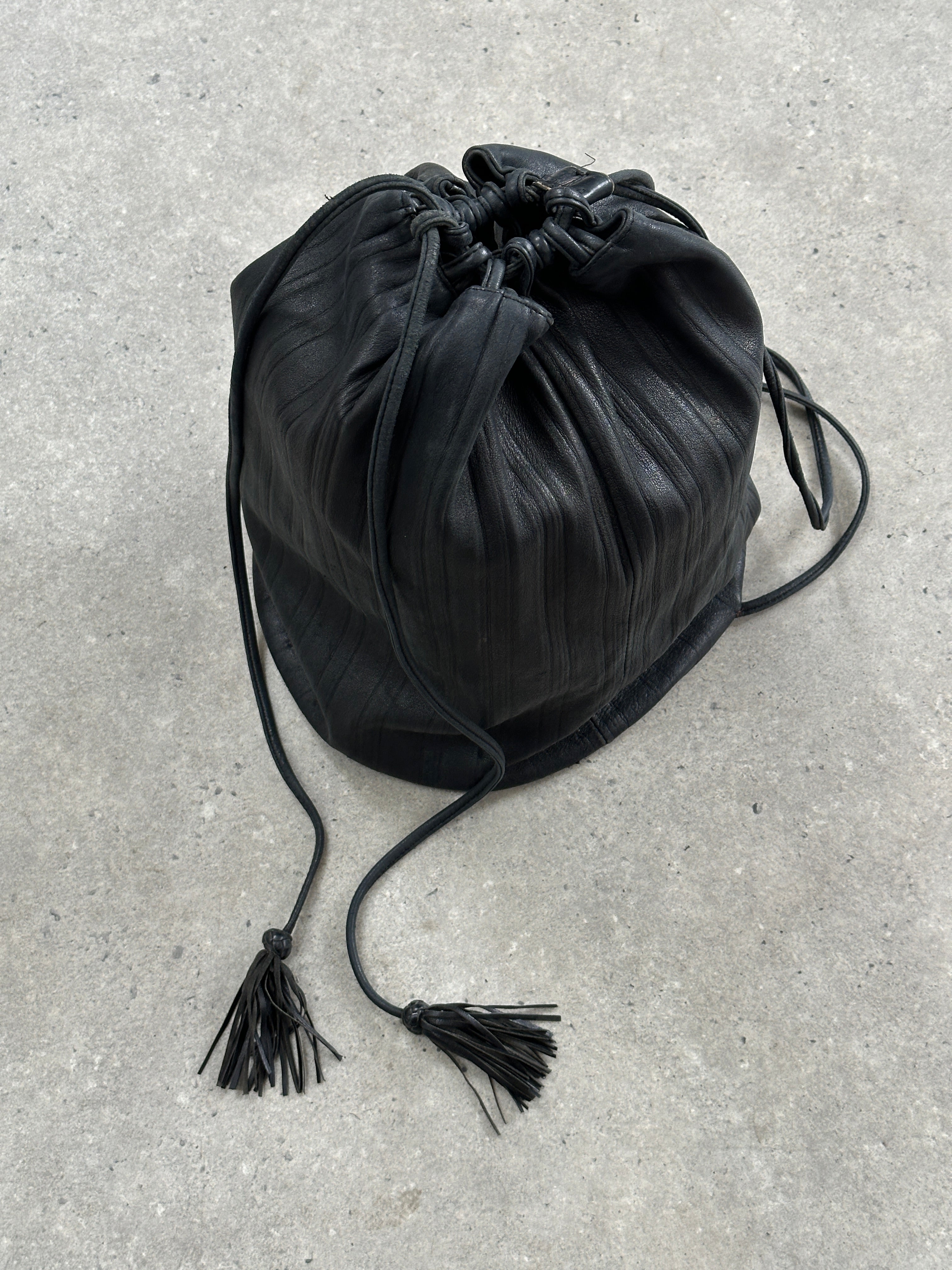 Giorgio Armani Le Collezioni leather rucksack bag with adjustable straps and sleek design, crafted from smooth leather.