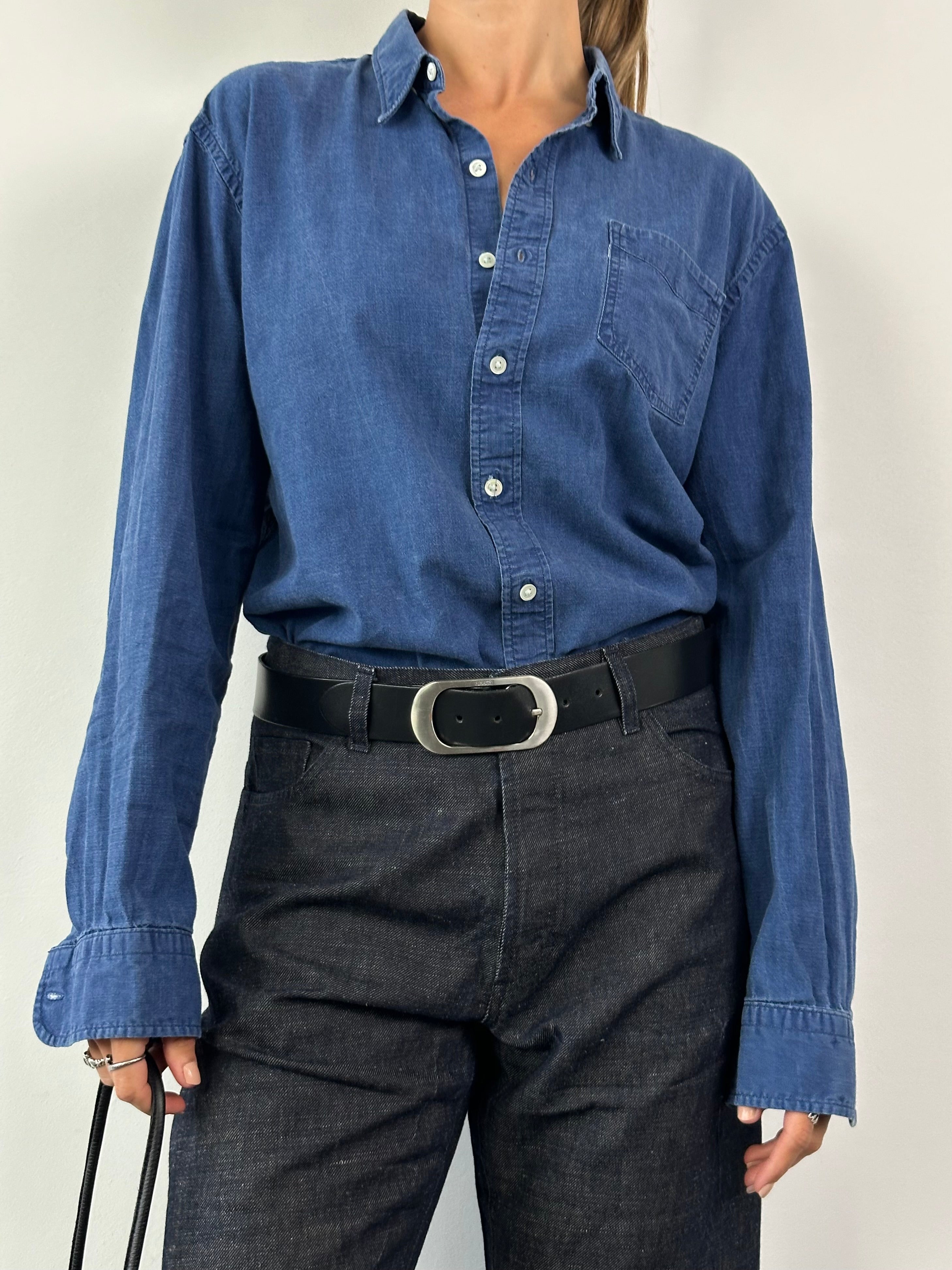Levi’s pure cotton denim shirt in XL size, featuring classic blue denim fabric and button-down front.