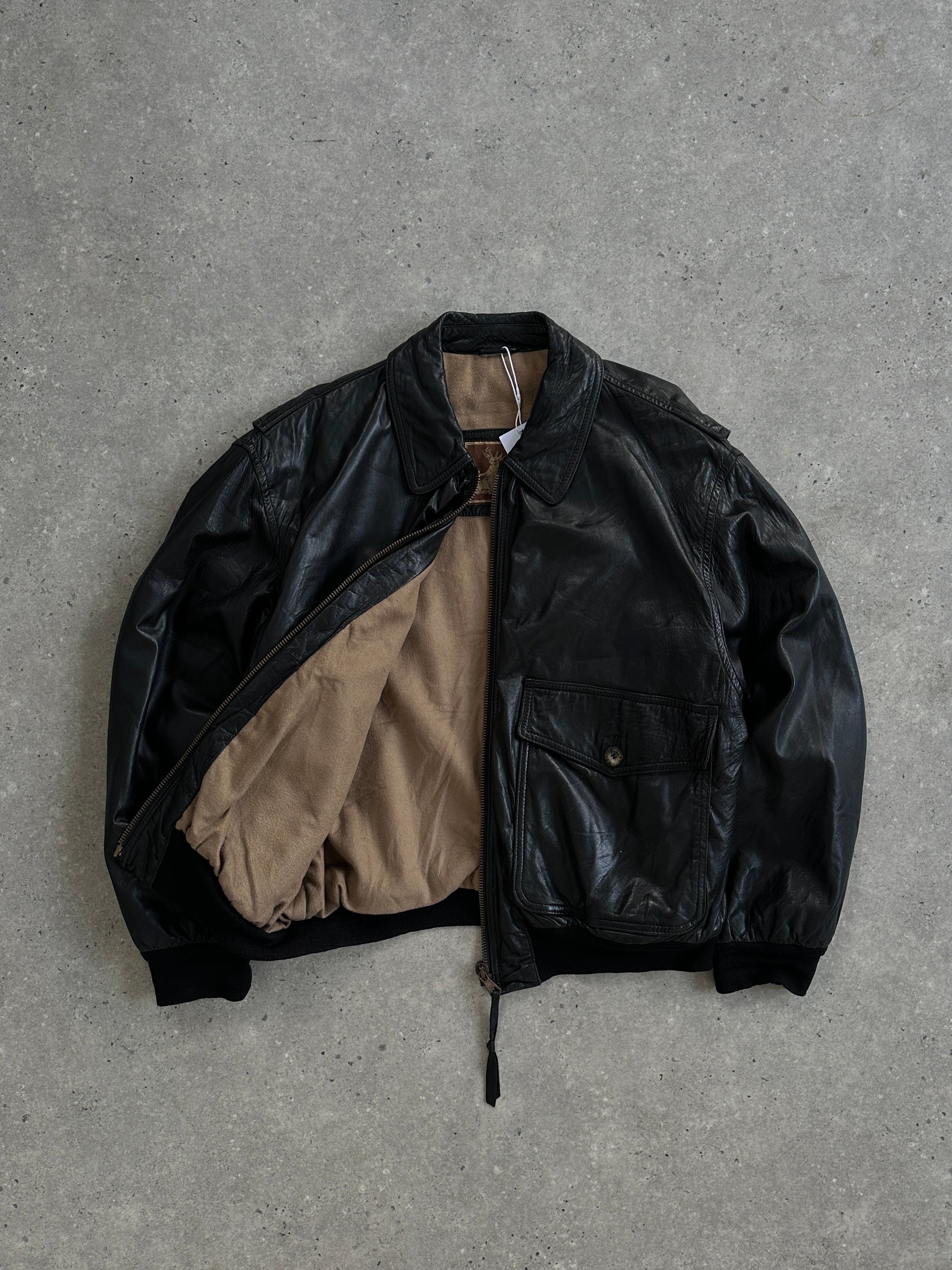 Vintage leather bomber jacket in size large, featuring classic style and detailed stitching.