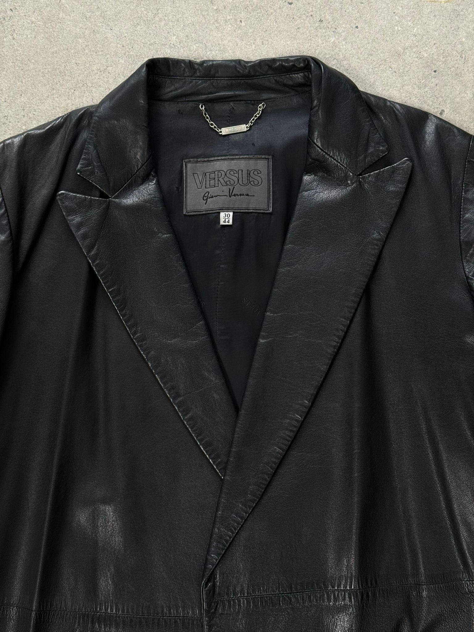 Versace Versus 1990s leather trench coat in black, tailored fit, with classic collar and button details, men's size S/M.