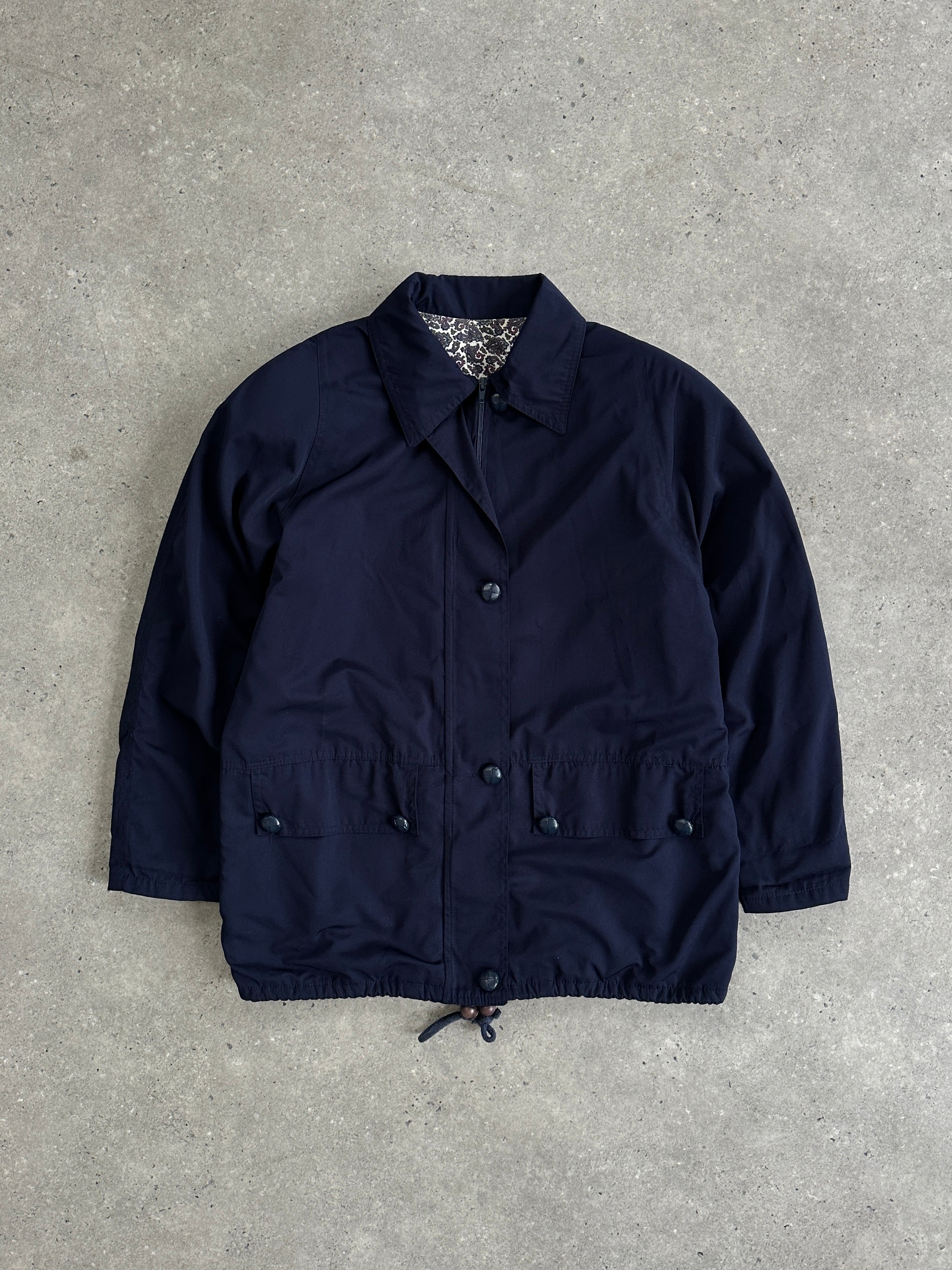 Vintage Italian bomber jacket in M/L size, featuring classic design and authentic detailing, displayed on a hanger.