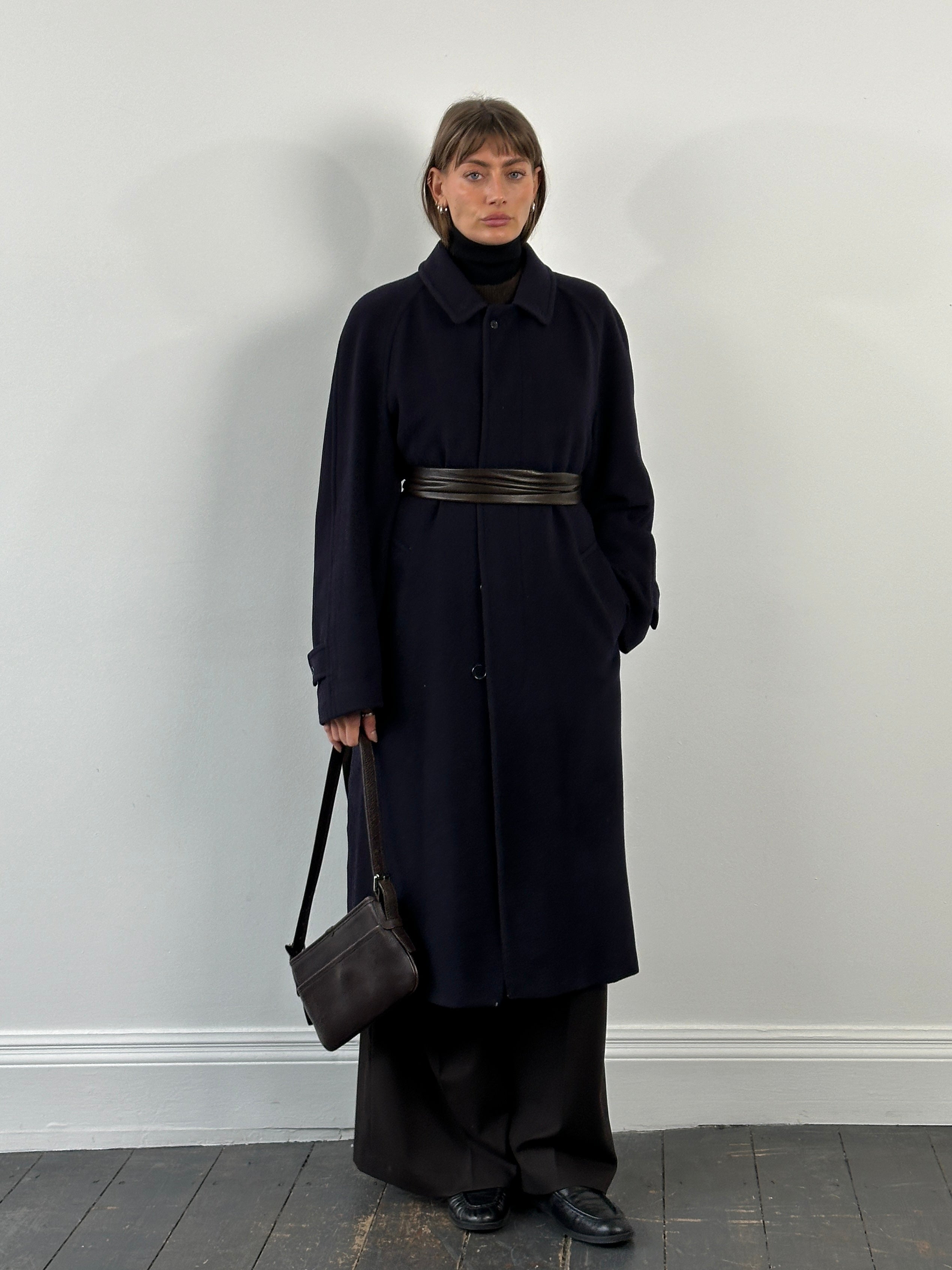 Jaeger 1990s high neck pure cashmere coat in XL, shown on a hanger, featuring a classic beige color and elegant design.