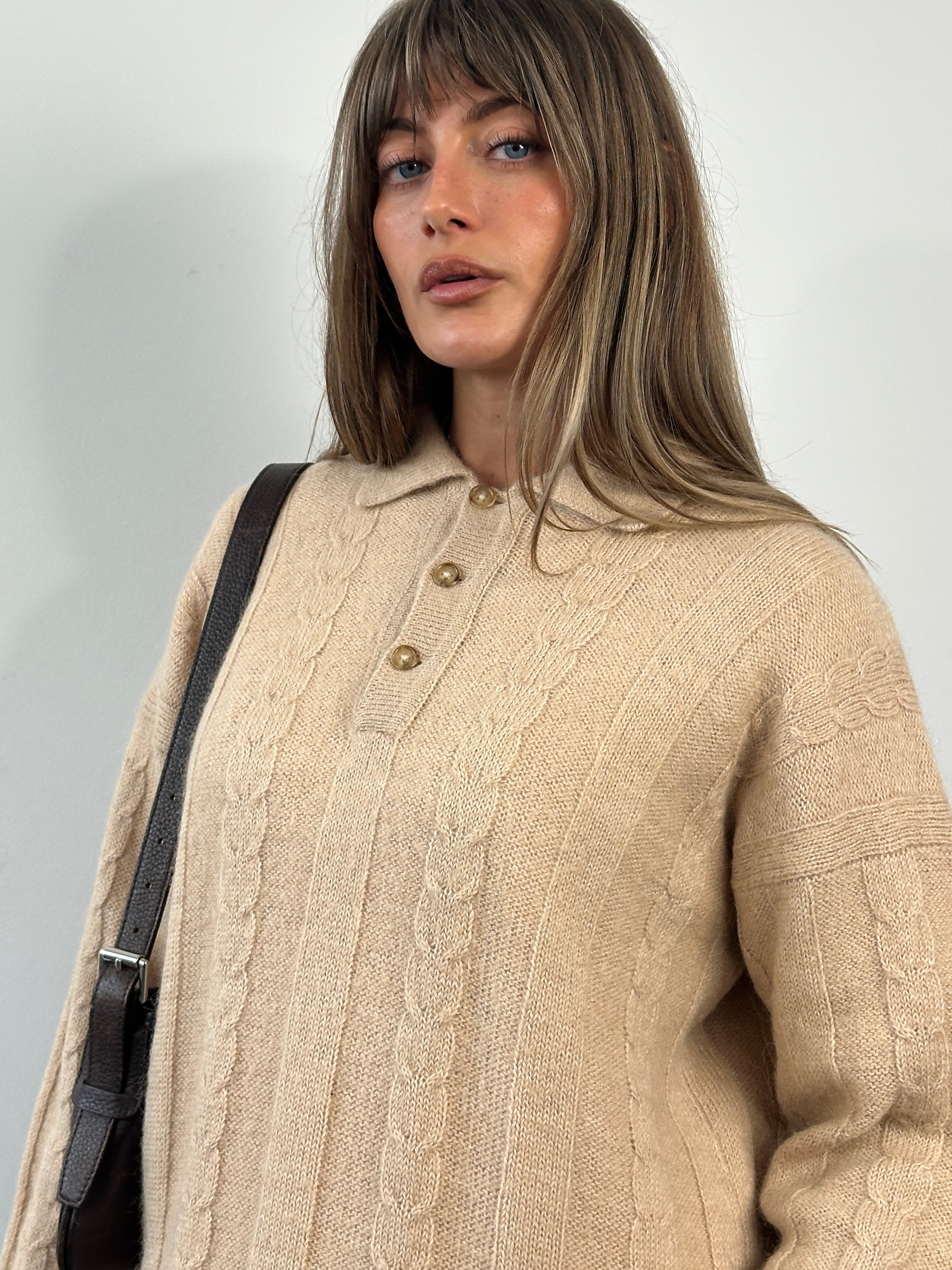 Vintage 1980s wool mohair knitted polo jumper in size M, featuring classic design and soft textured knit fabric.