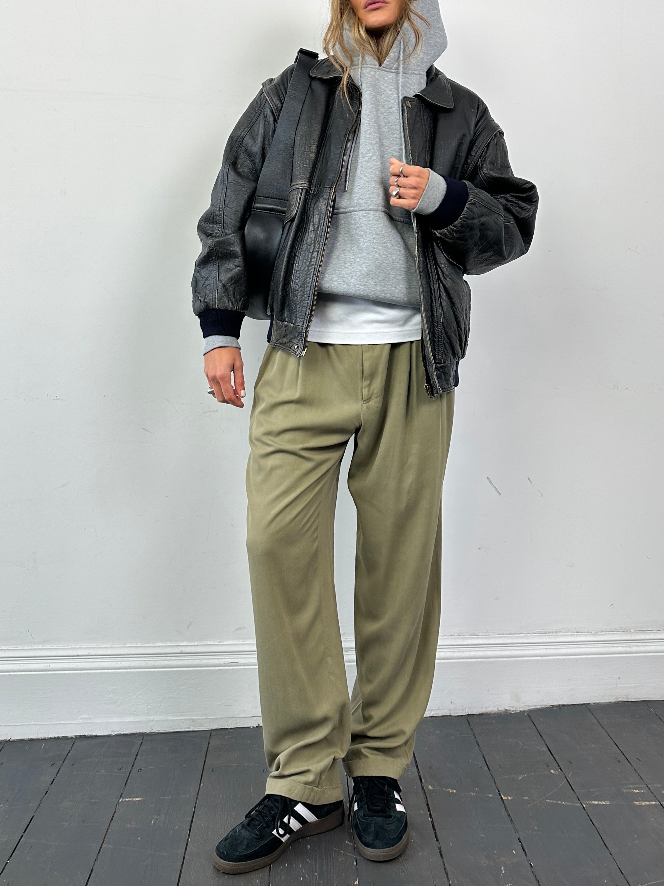 Versace Versus silk high-waisted straight-leg trousers in dark color, front view showing tailored fit and elegant design.