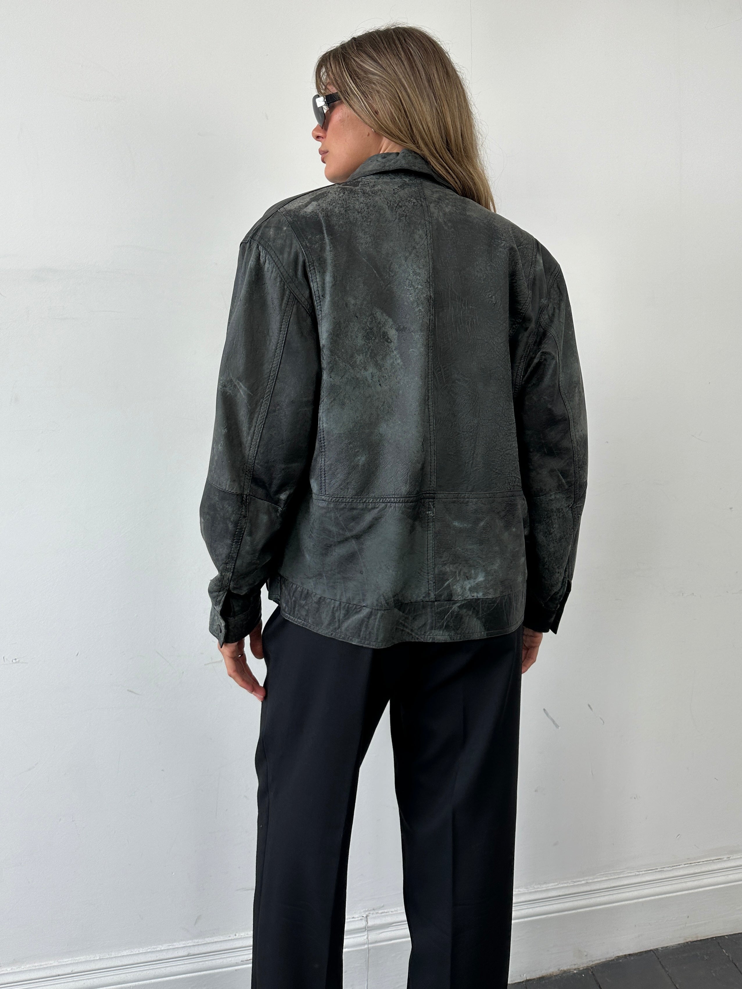 Vintage distressed marbled leather jacket, men's size M, featuring a rugged, textured leather design and classic style.