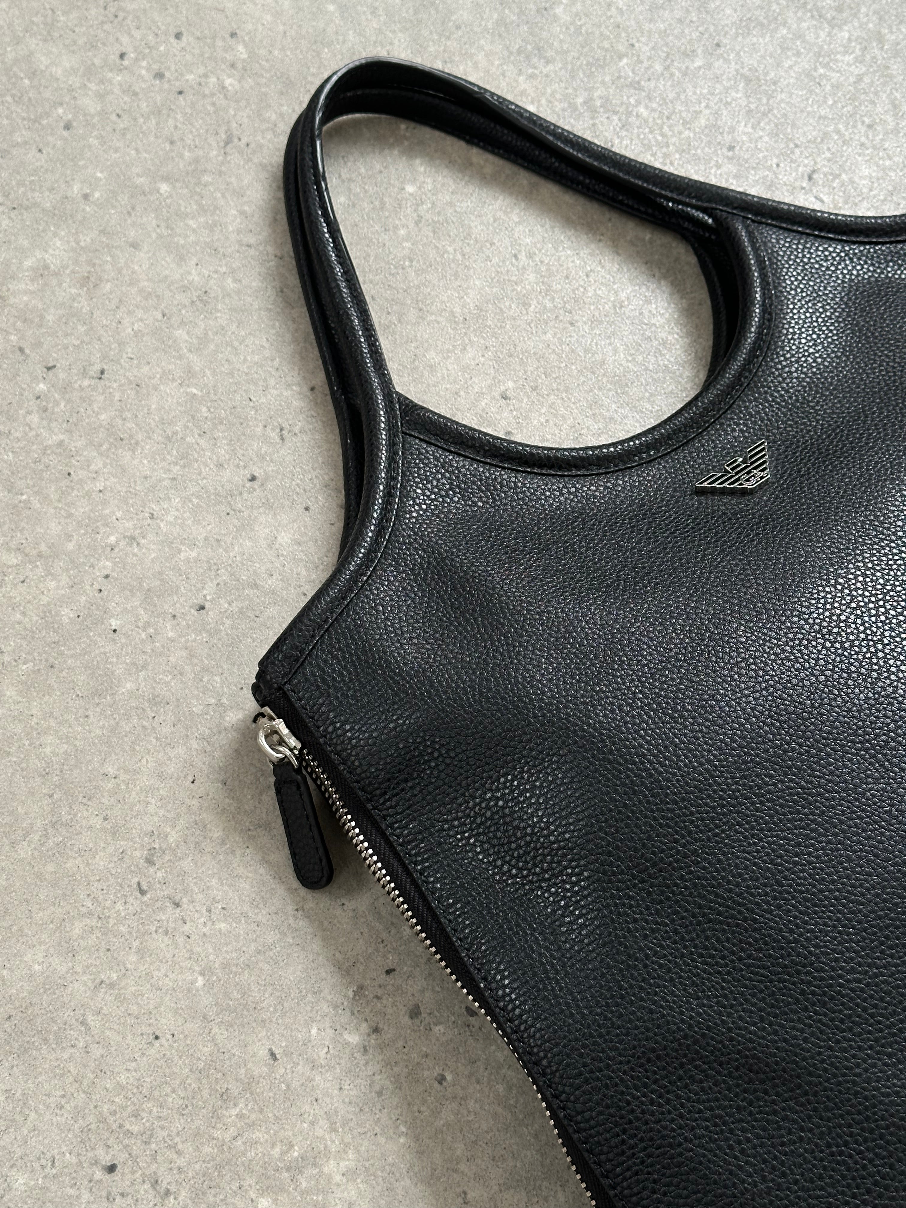 Emporio Armani 1990s leather shoulder bag with sleek design and silver hardware, featuring a structured silhouette and adjustable strap.