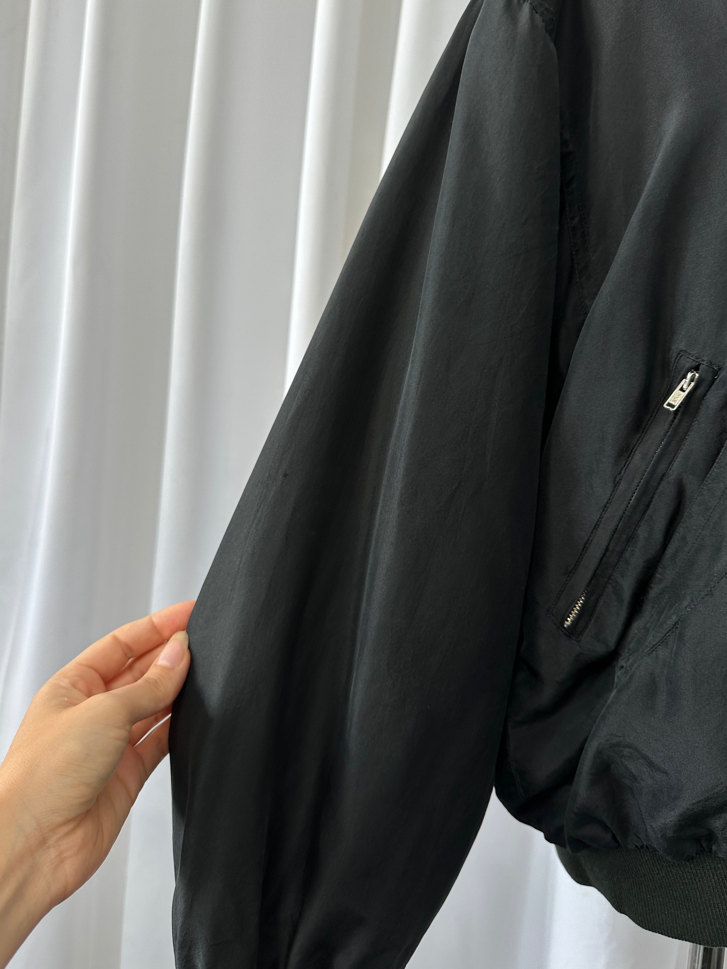 Vintage 1990s pure silk bomber jacket in size M/L, featuring a classic retro design with a smooth silk finish.