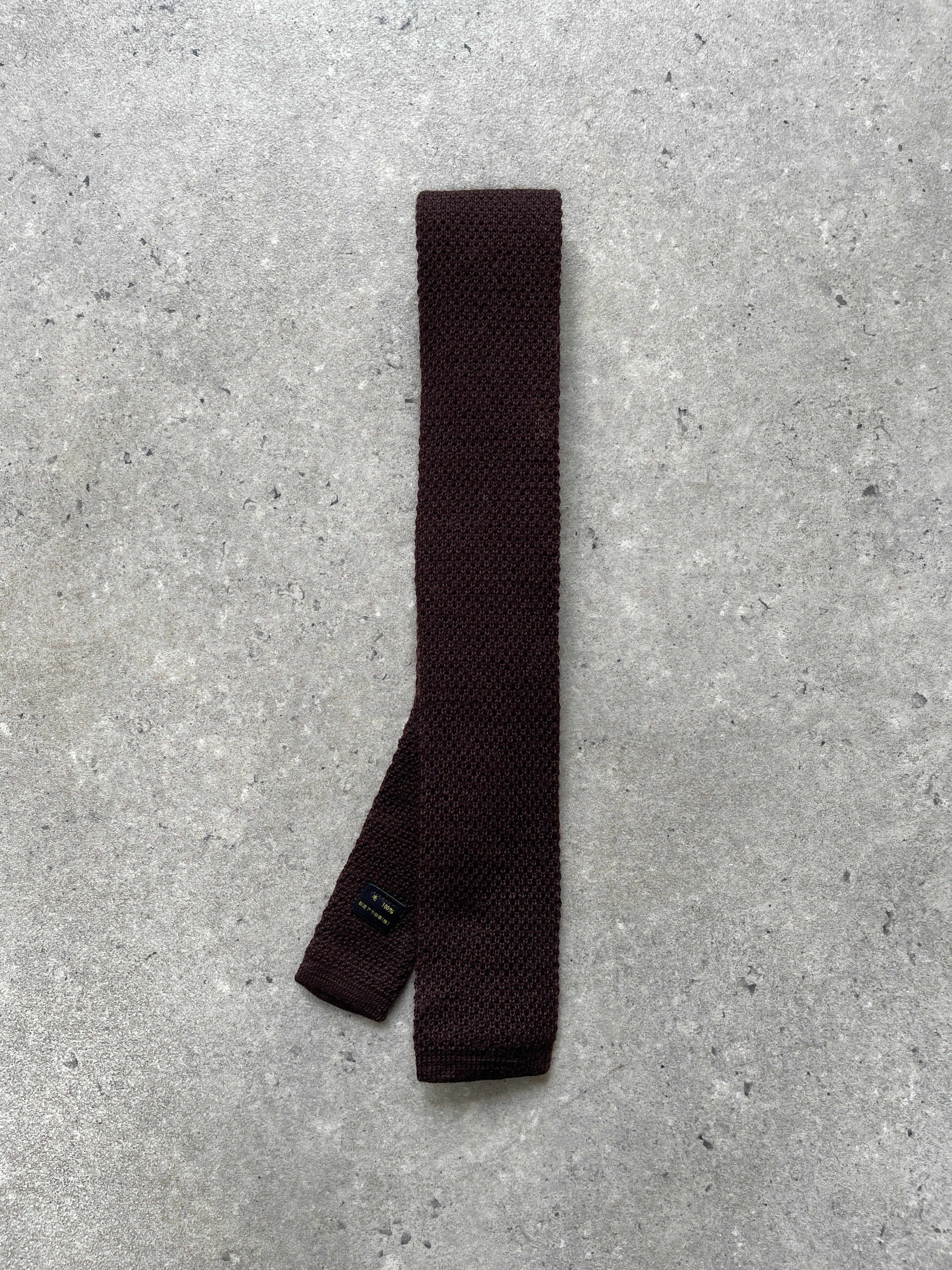 Vintage Japanese 1990s pure wool knitted tie with intricate pattern, ideal for adding a classic touch to formal outfits.