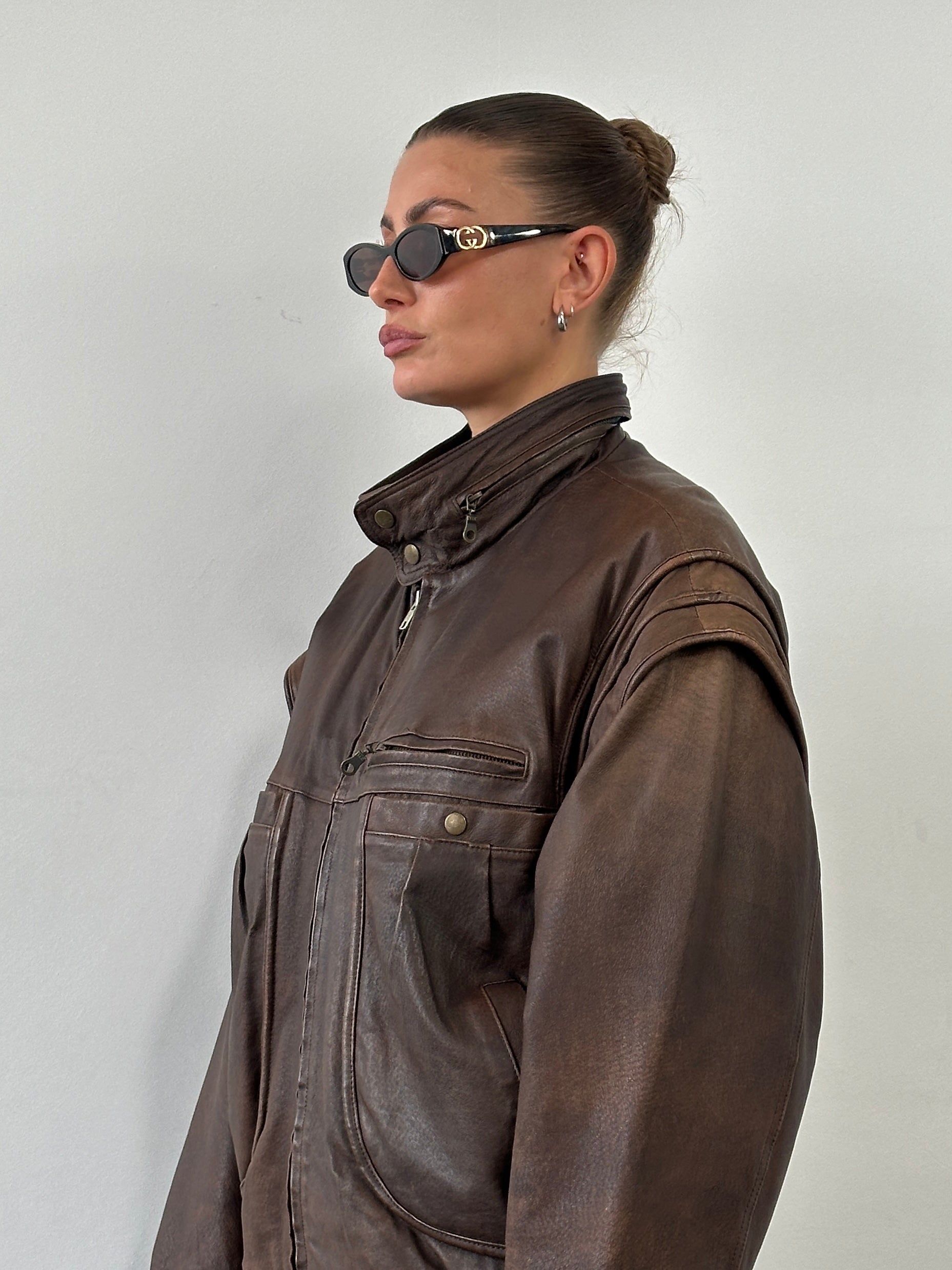 Vintage high neck aged leather bomber jacket in size L/XL, featuring classic style and distressed leather texture.