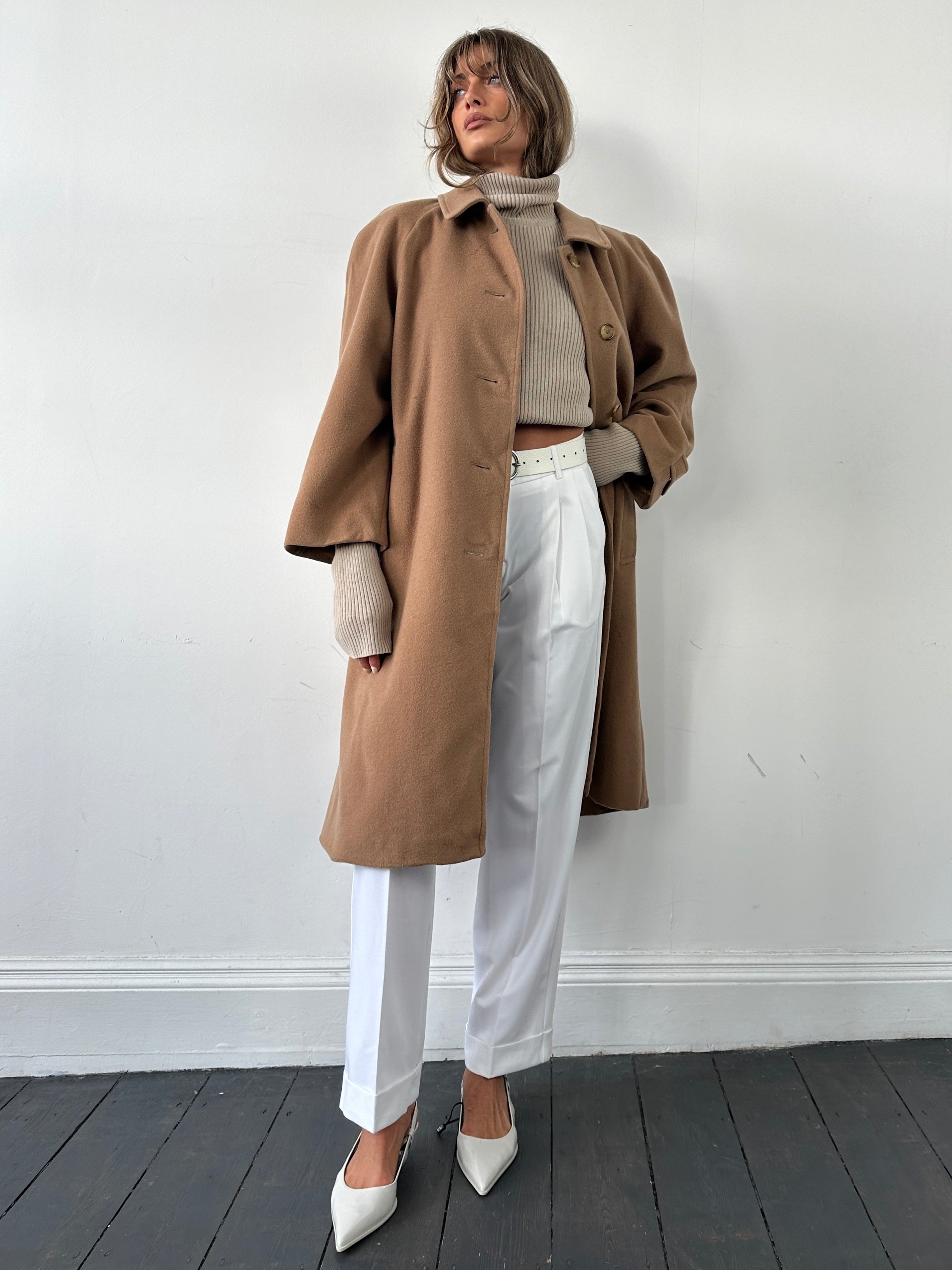 Burberry wool camel hair single-breasted coat in size L, featuring classic design and tailored fit, displayed on a hanger.